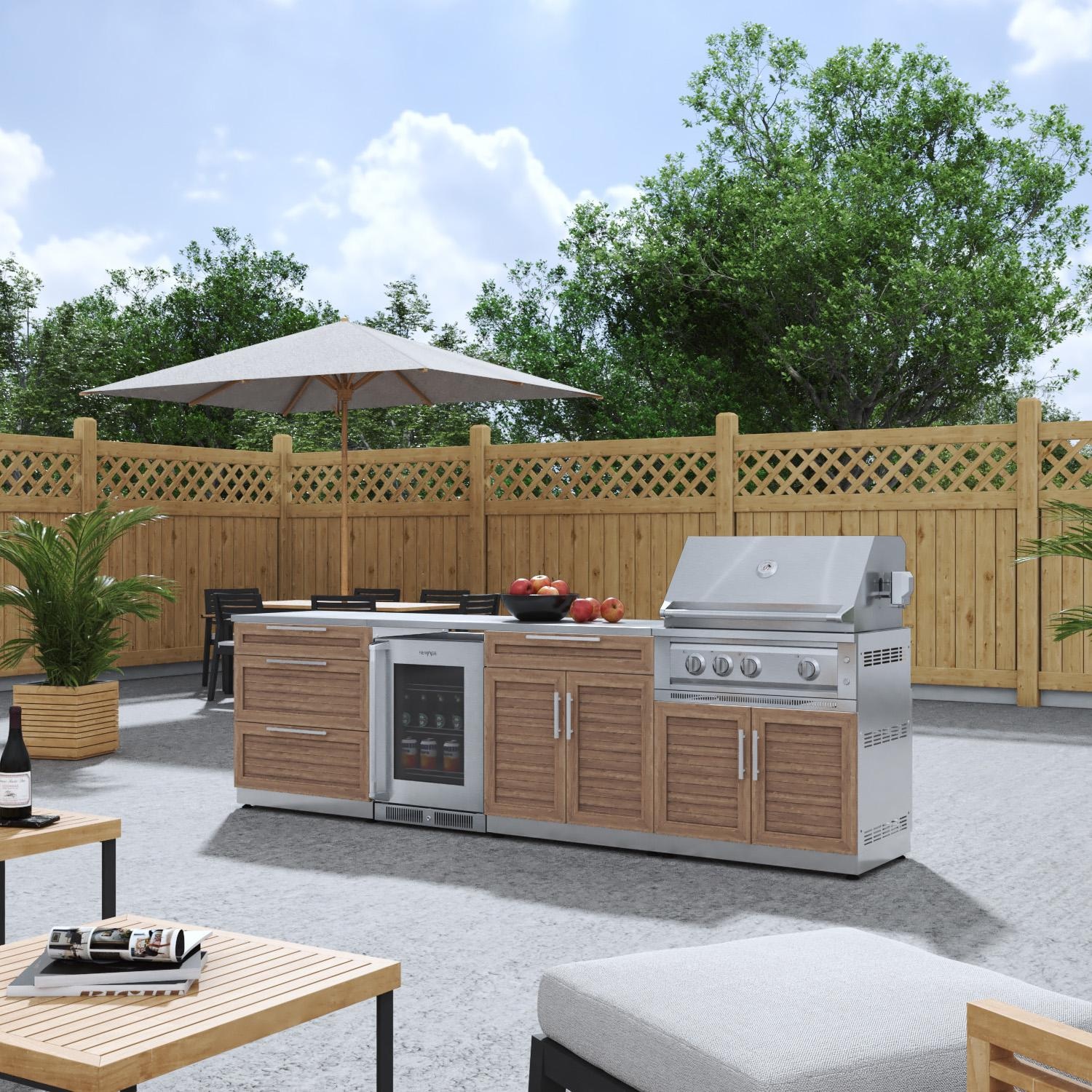 NewAge Products 67916 Classic Series 10 Ft Outdoor Kitchen Island w/ 33-in Natural Gas Grill, Glass Door Refrigerator, Trash Bin, Door & Drawer in Grove/Stainless Steel - Angled on Patio - Lifestyle thumbnail
