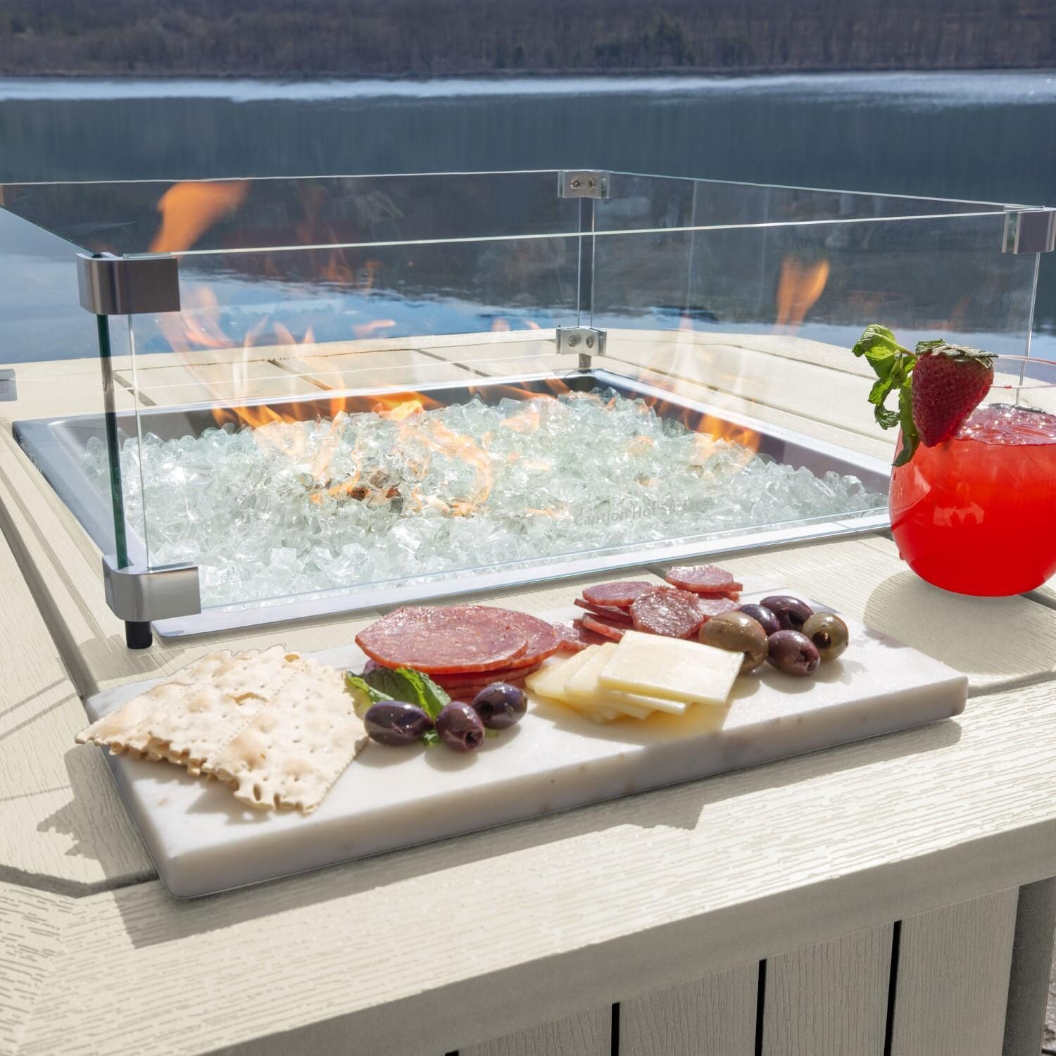 Harborview Octagonal Fire Pit Table in Whitewash by Lakeview Outdoor Designs - In Use - Charcuterie Board - Lifestyle thumbnail