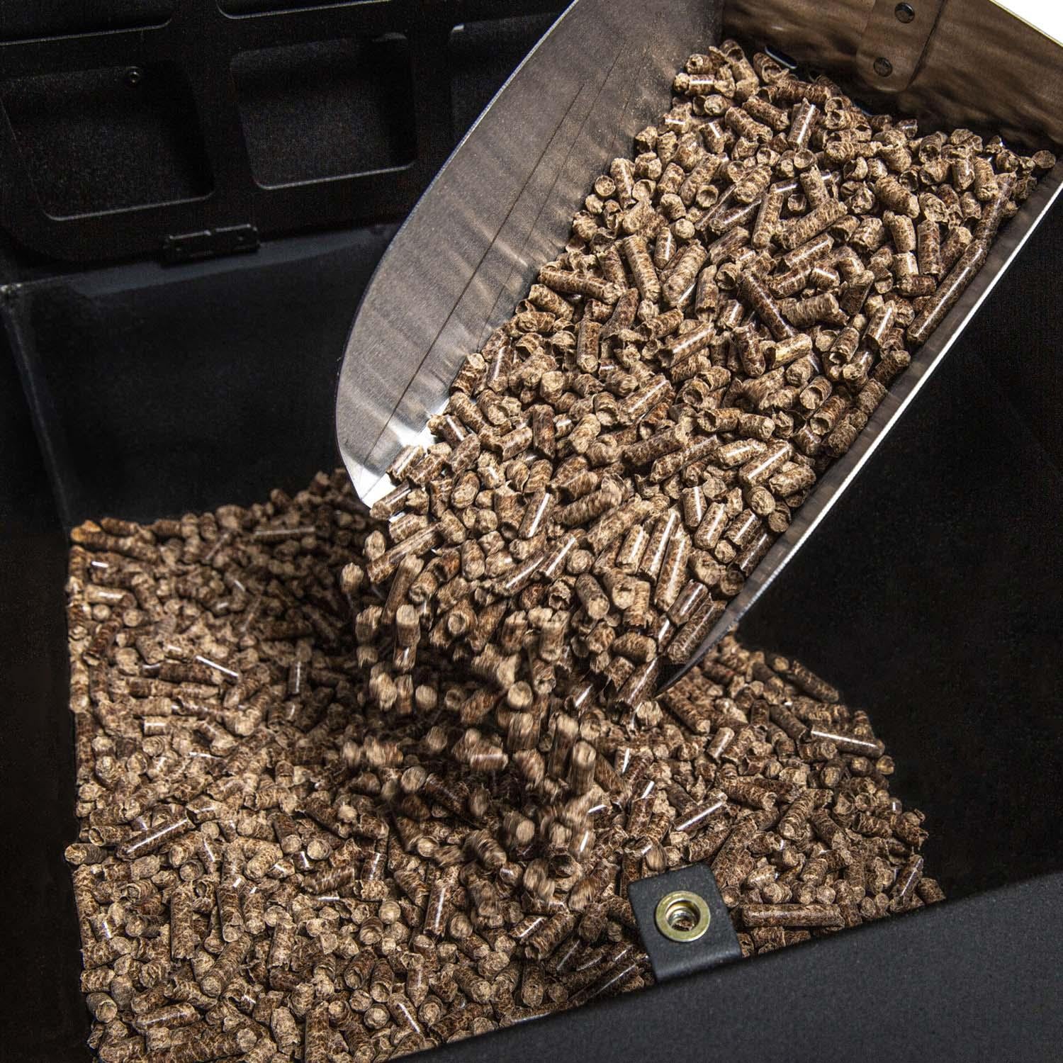 Broil King 495051 Regal 400 Wi-Fi & Bluetooth Controlled 26-in Pellet Grill - Loading Pellets in Hopper - Lifestyle thumbnail