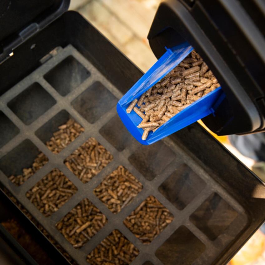 Broil King Pellet Storage Bin - 66900 - Pouring Out - Lifestyle thumbnail