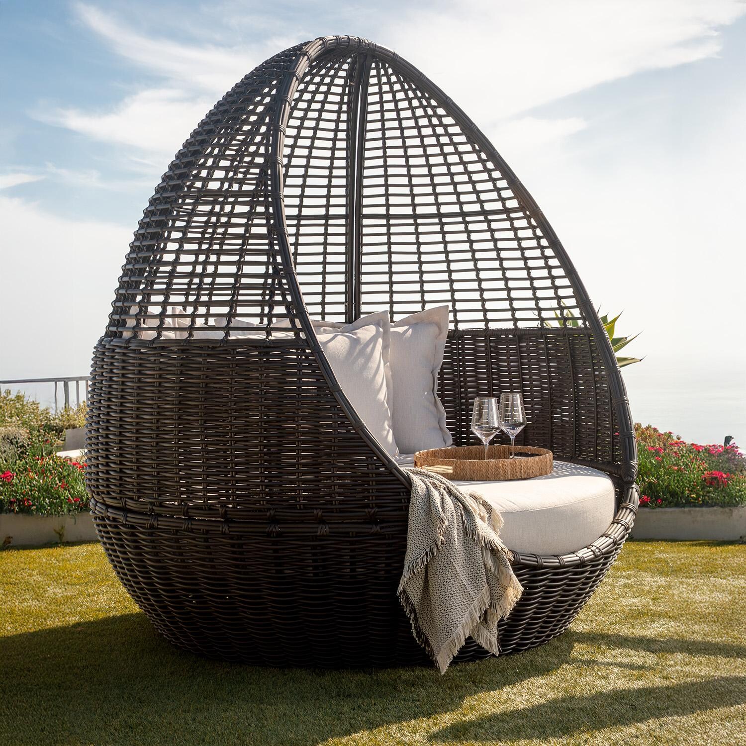 Cabo Resin Wicker Daybed in Kahlua/Soothe Pearl by Sunset West - In Yard Angled - Lifestyle thumbnail
