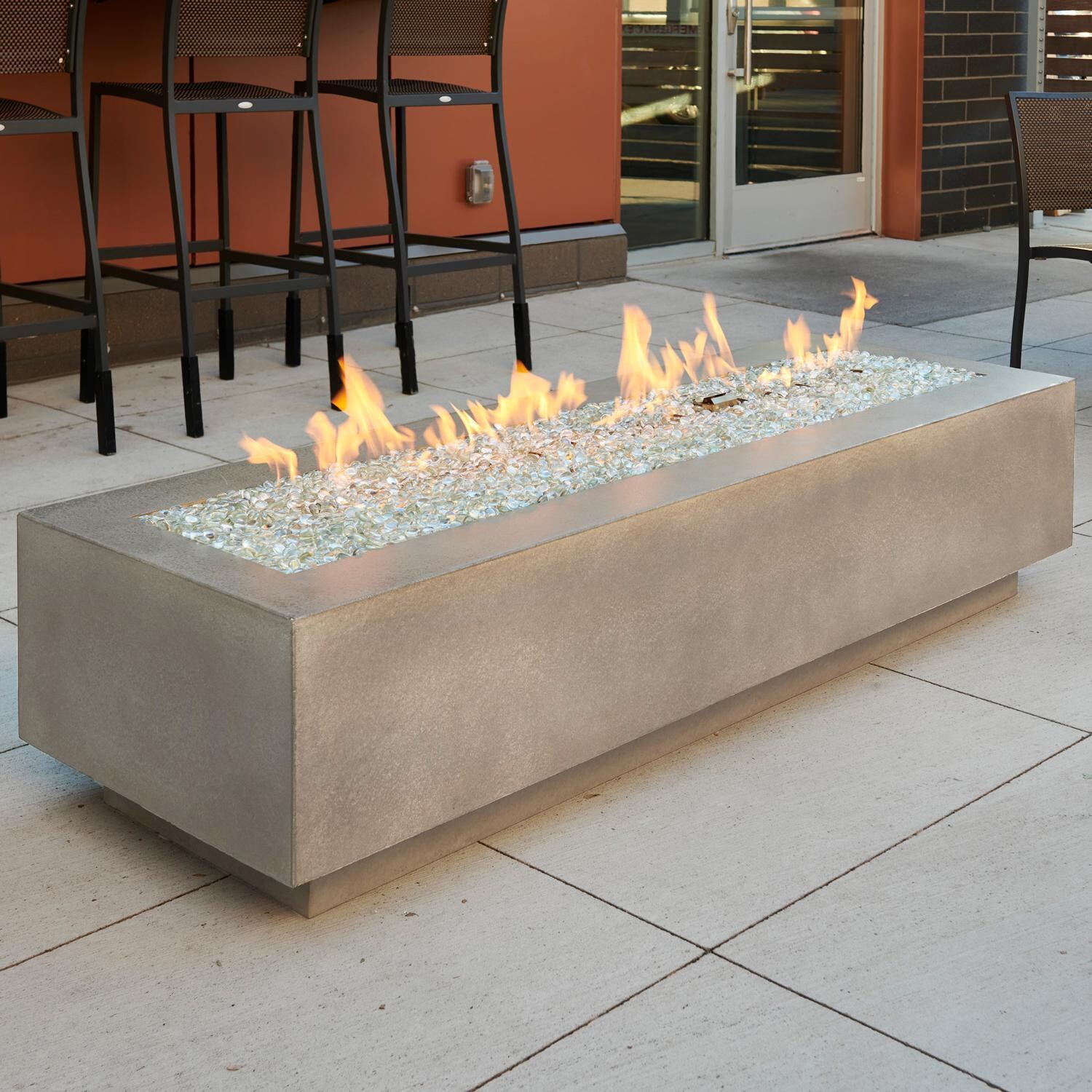 Cove 72 Inch Rectangular GFRC Natural Gas Fire Pit Table w/ Electronic Ignition in Natural Gray by The Outdoor GreatRoom Company - Lifestyle thumbnail