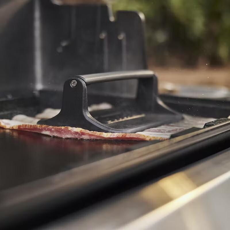 Weber 6785 Cast Iron Griddle Press - Pressing Bacon - Lifestyle thumbnail