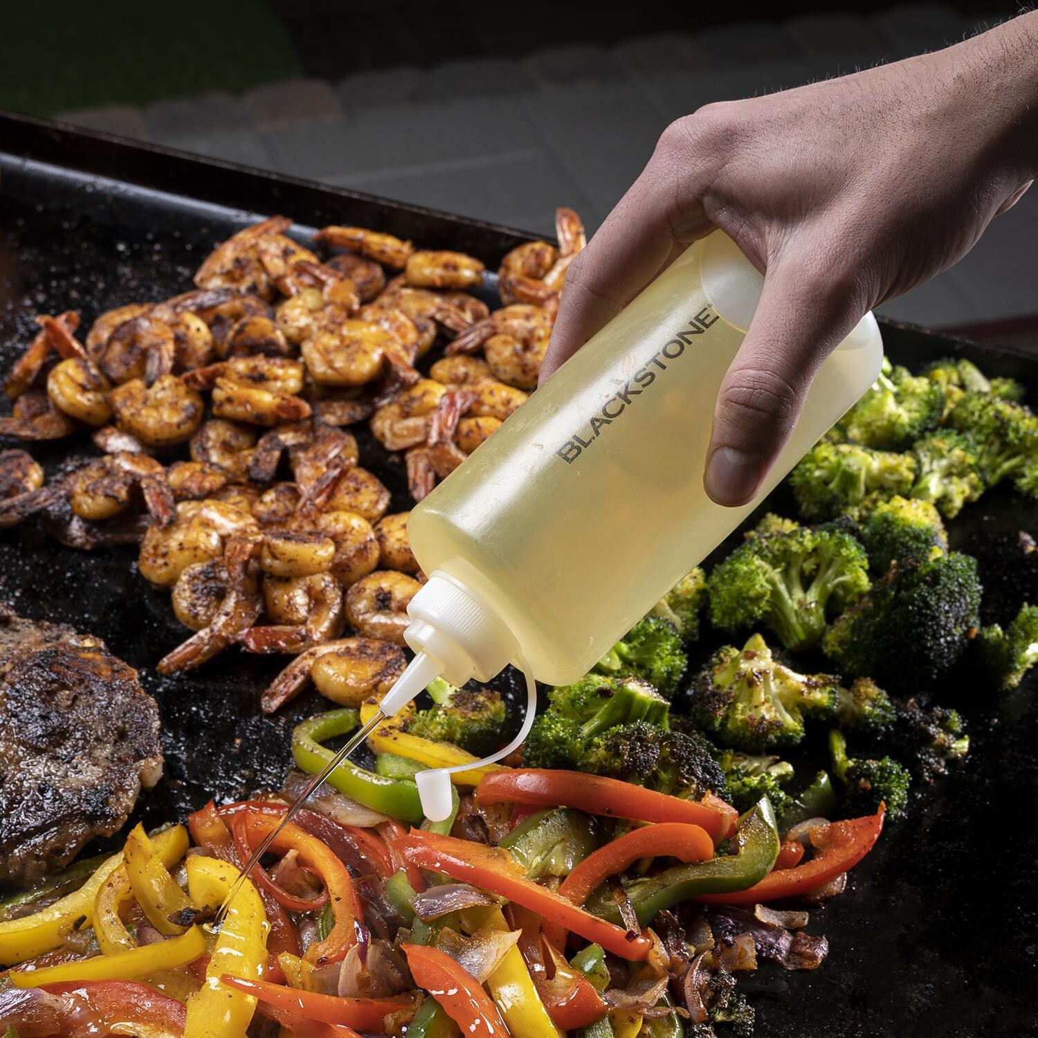 Blackstone Products 1542 5-Piece Griddle Toolkit - Adding Oil thumbnail