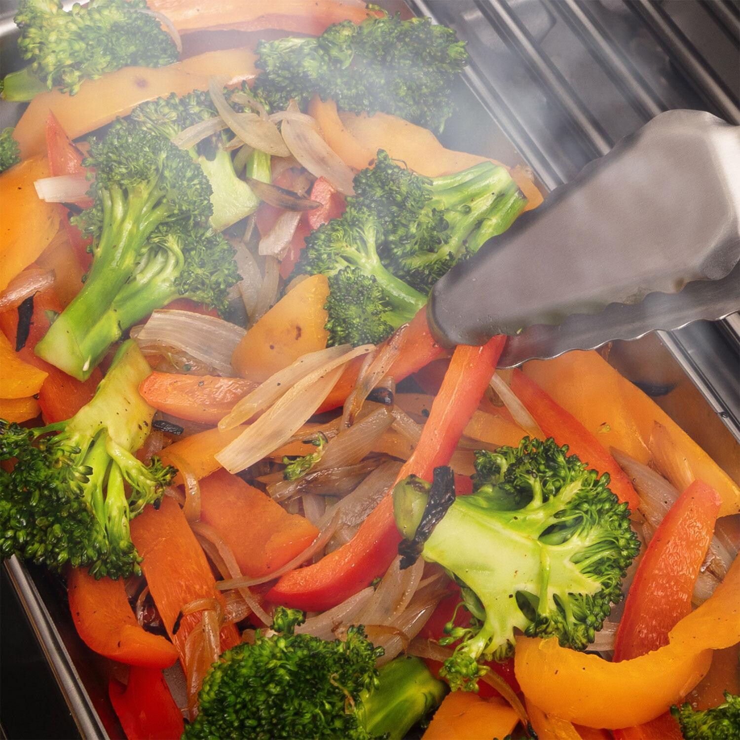 Broil King 64046 Ultra Lite 12-in Stainless Steel Tongs - Veggies - Close Up - Lifestyle thumbnail