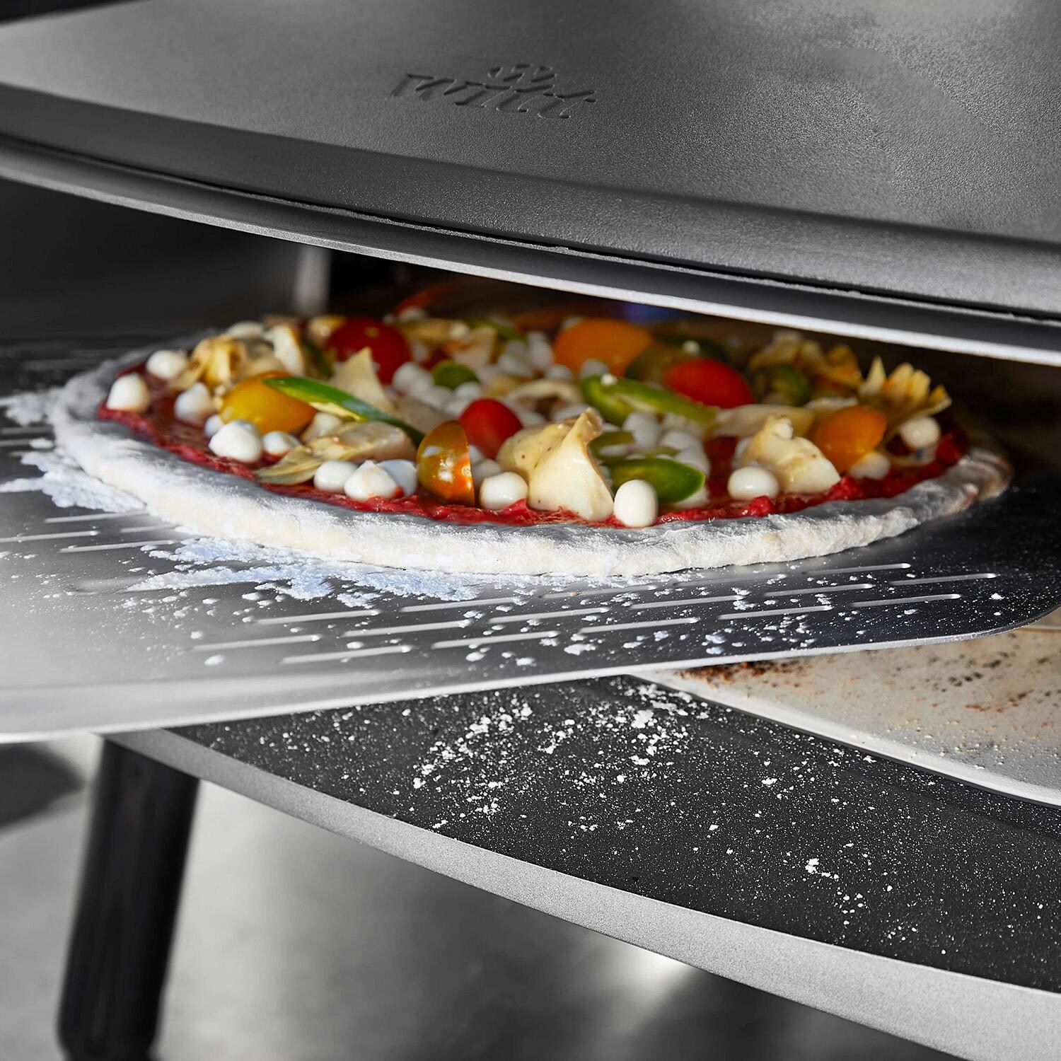 Witt 48651001 12-in Perforated Aluminum Pizza Peel - Lifestyle thumbnail