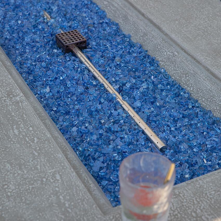 Riviera OFG415LG-LP 60 Inch Rectangular Concrete Propane Fire Pit Table in Gray By Elementi - Fire Glass - Off - Close Up View - Detail thumbnail