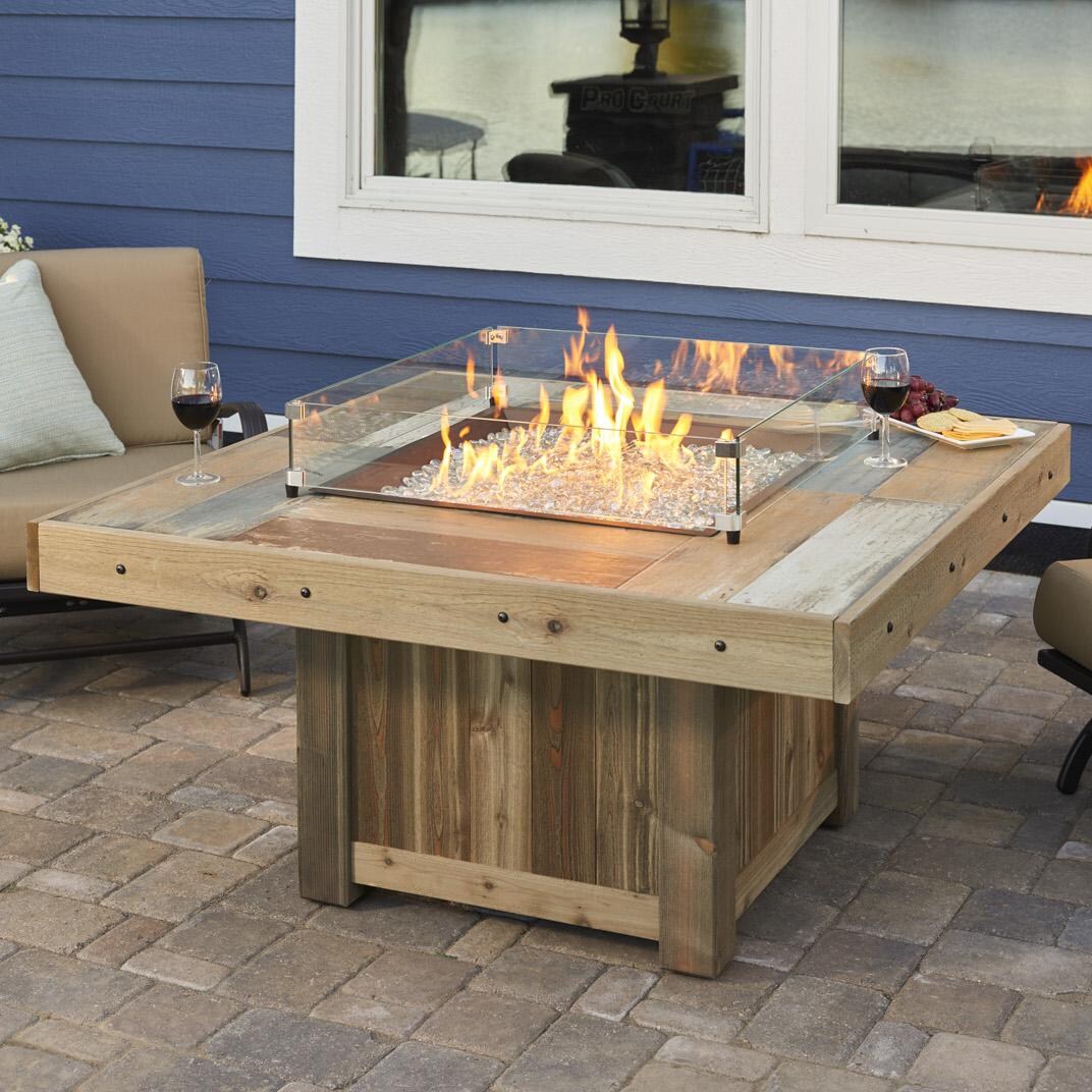 The Outdoor GreatRoom Company Vintage Square Gas Fire Pit Table - Lifestyle - Glass wind guard pictured is optional accessory thumbnail