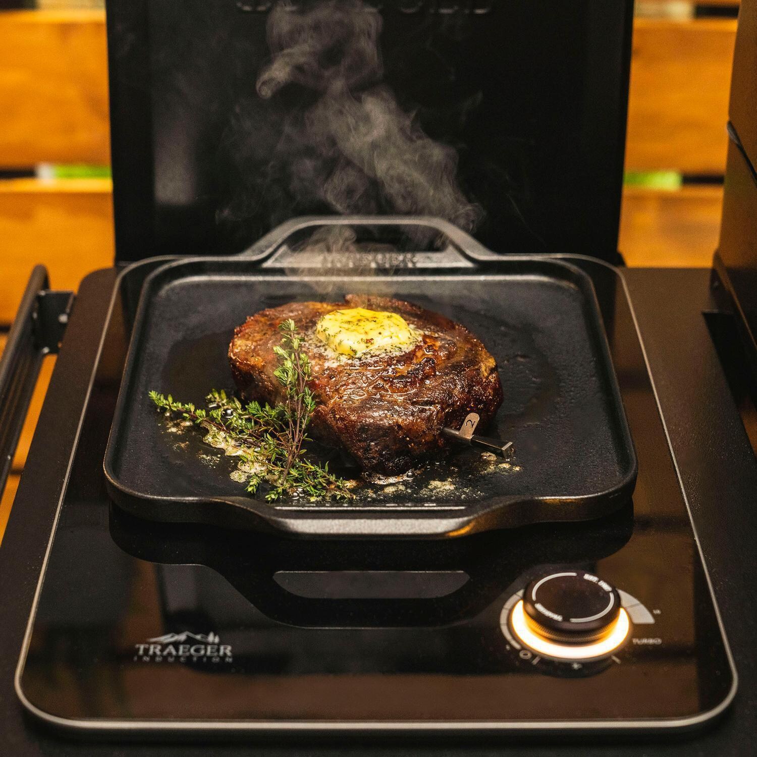 Traeger All-New Timberline XL Wi-Fi Controlled Wood Pellet Grill w/ WiFire 5 Pc Bundle - Cooking on Patio - White Background thumbnail