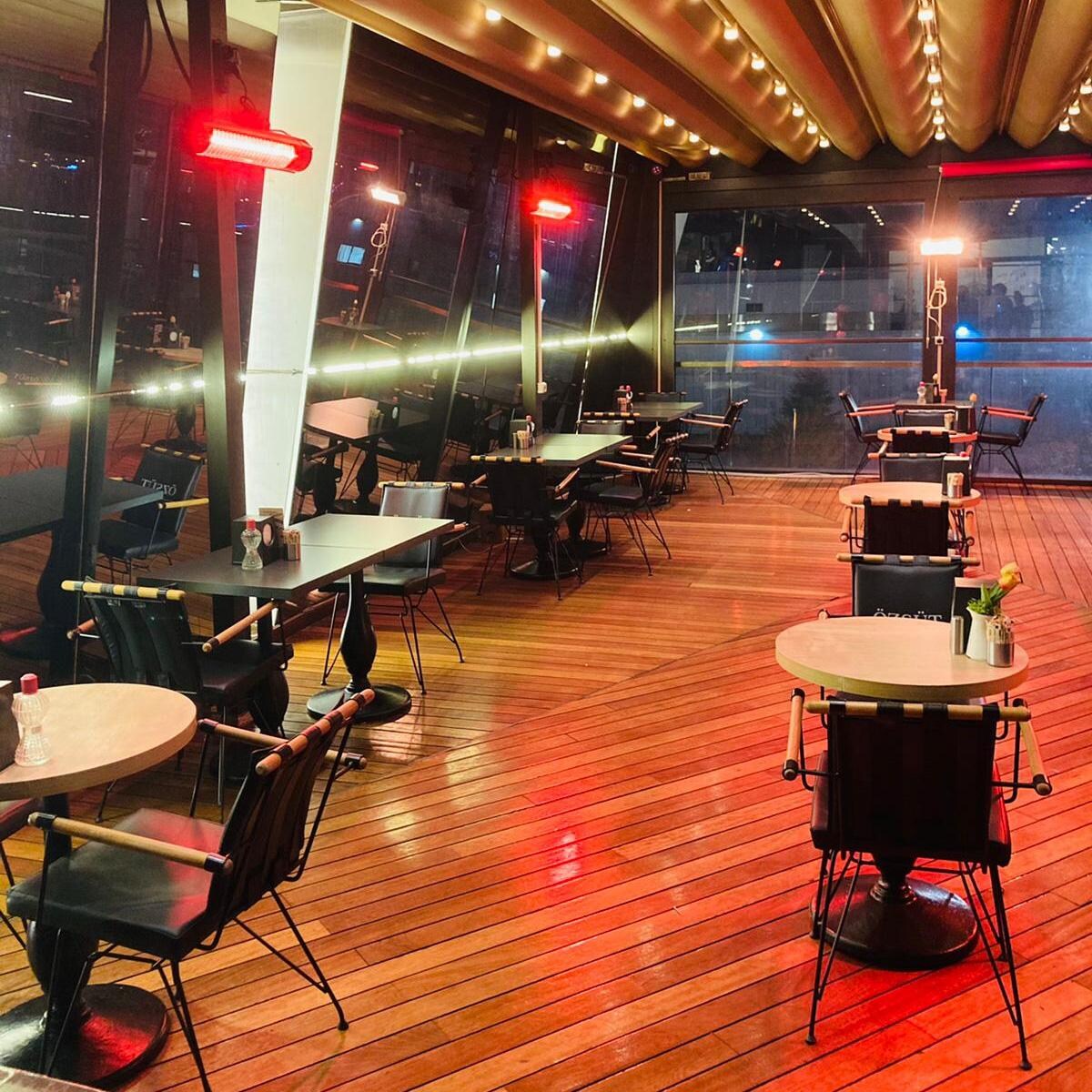 RADtec T6000/18R2 Torrid Series 77-in 6000W Electric Infrared Patio Heater - Restaurant Side View - Lifestyle thumbnail