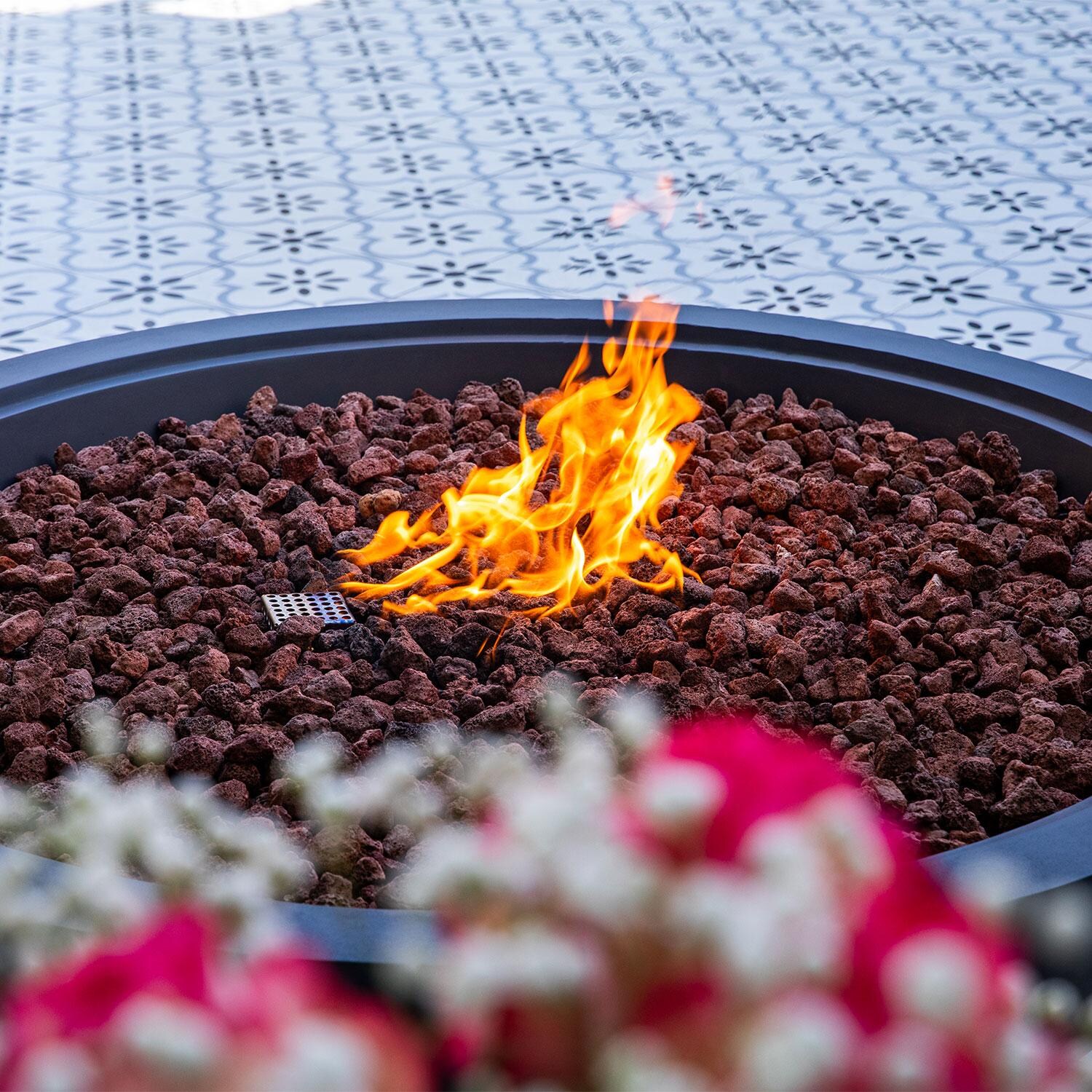 Elementi OFG420DG-LP Rose Bowl 48-in Liquid Propane Concrete Fire Pit in Dark Grey - On - Lifestyle thumbnail