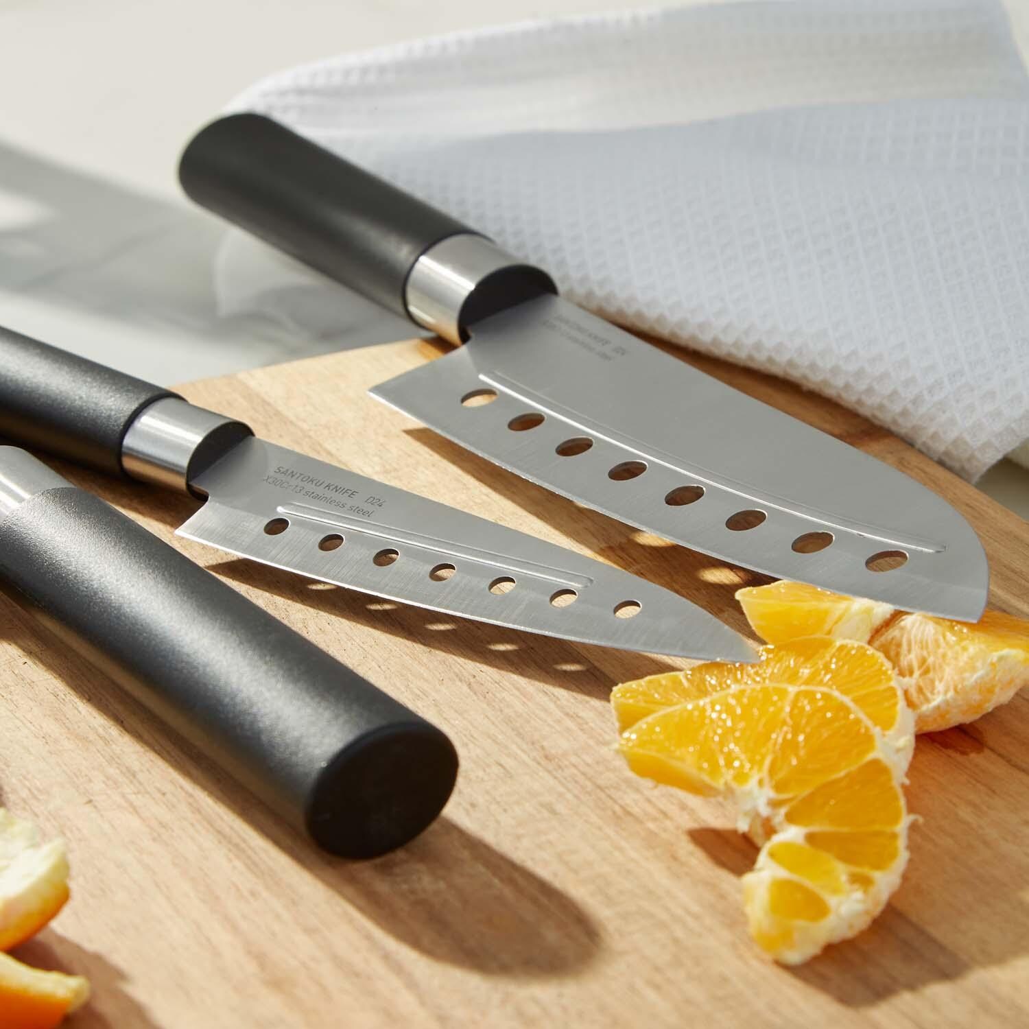 BergHOFF DiNA Codon 5 Pc Stainless Steel Knife Set - Cutting Oranges - Lifestyle thumbnail
