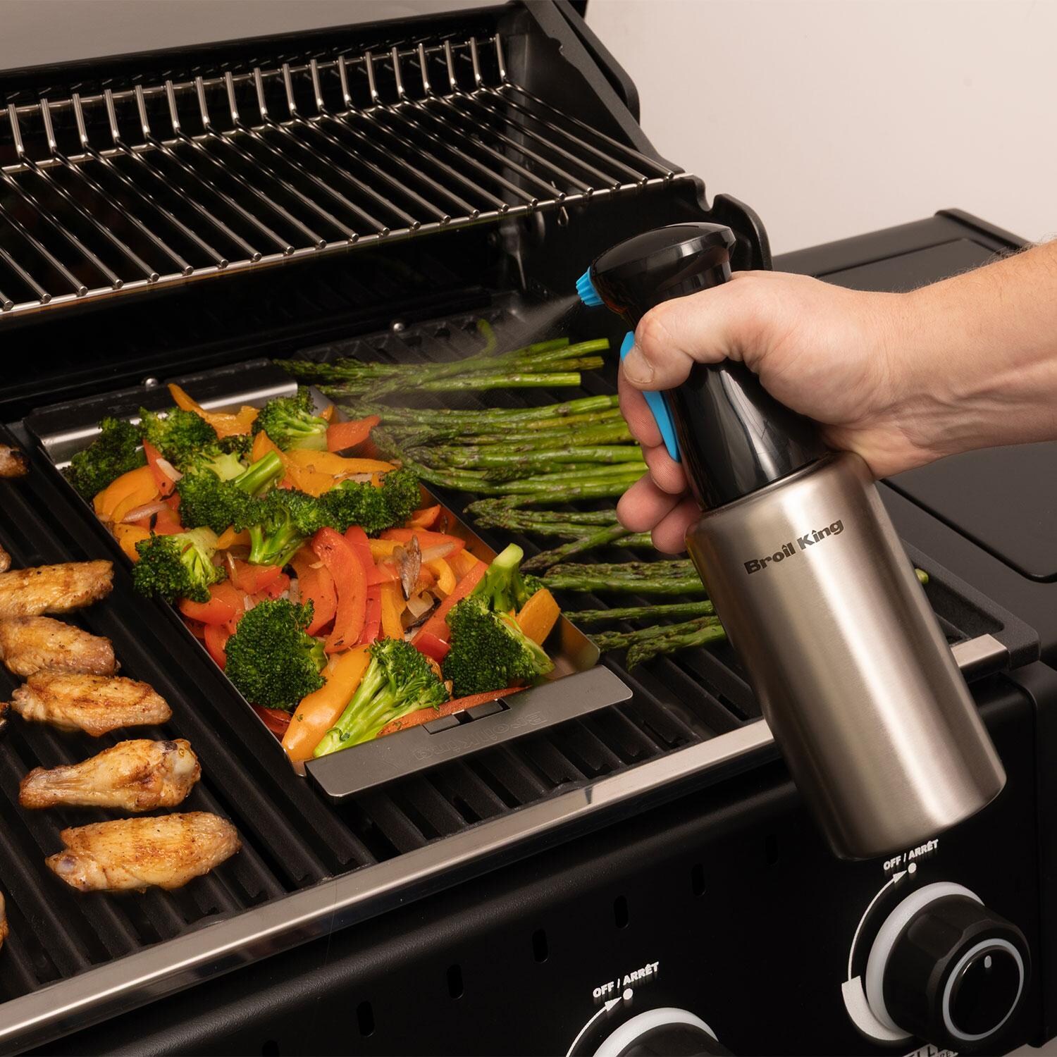 Broil King 60970 Stainless Steel Oil Sprayer Pump Bottle - Spraying Oil on Food - Lifestyle thumbnail
