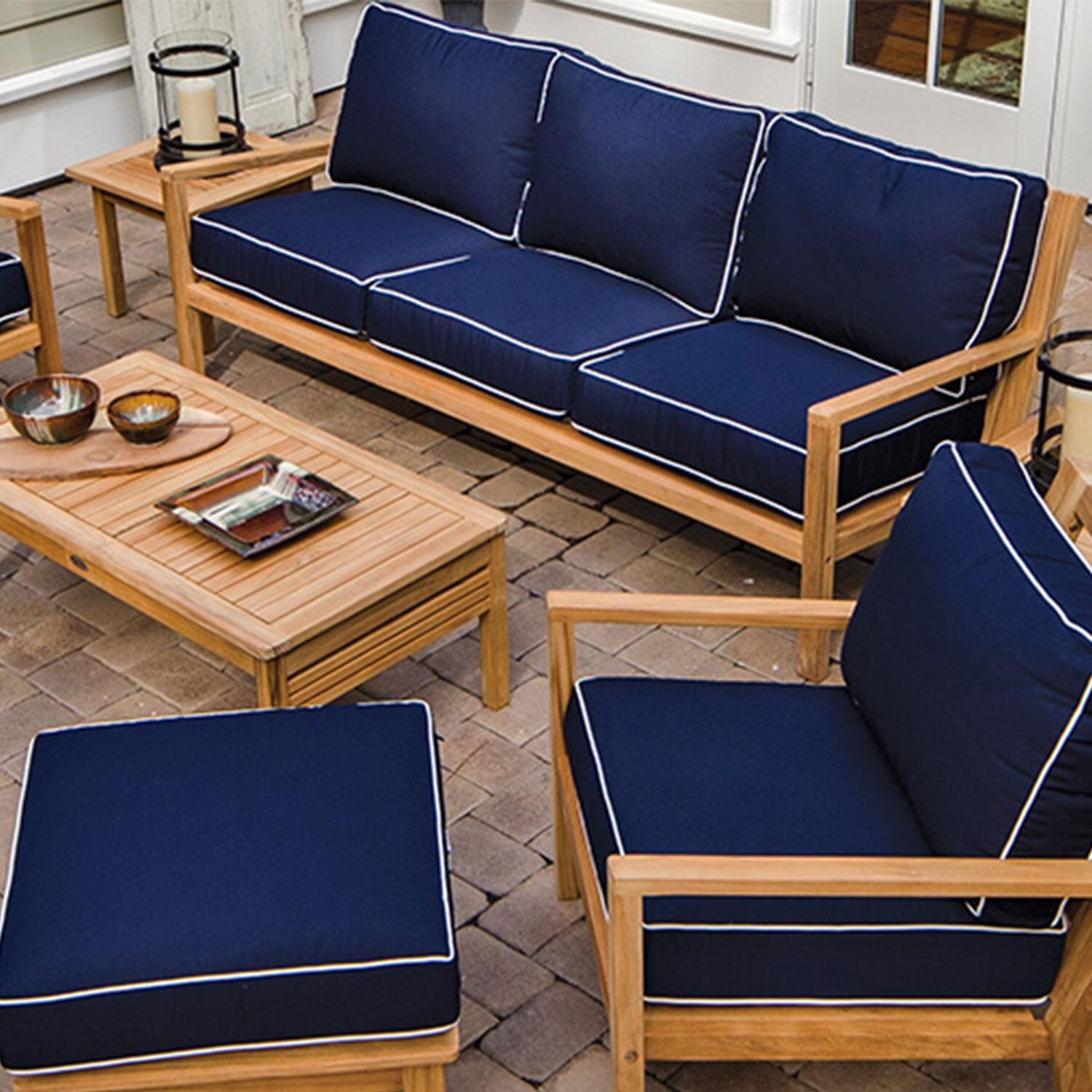 Royal Teak Collection Coastal Teak Patio Sofa W/ Sunbrella Canvas Natural Cushions - On Patio - Shown in Canvas Navy finish - Lifestyle thumbnail