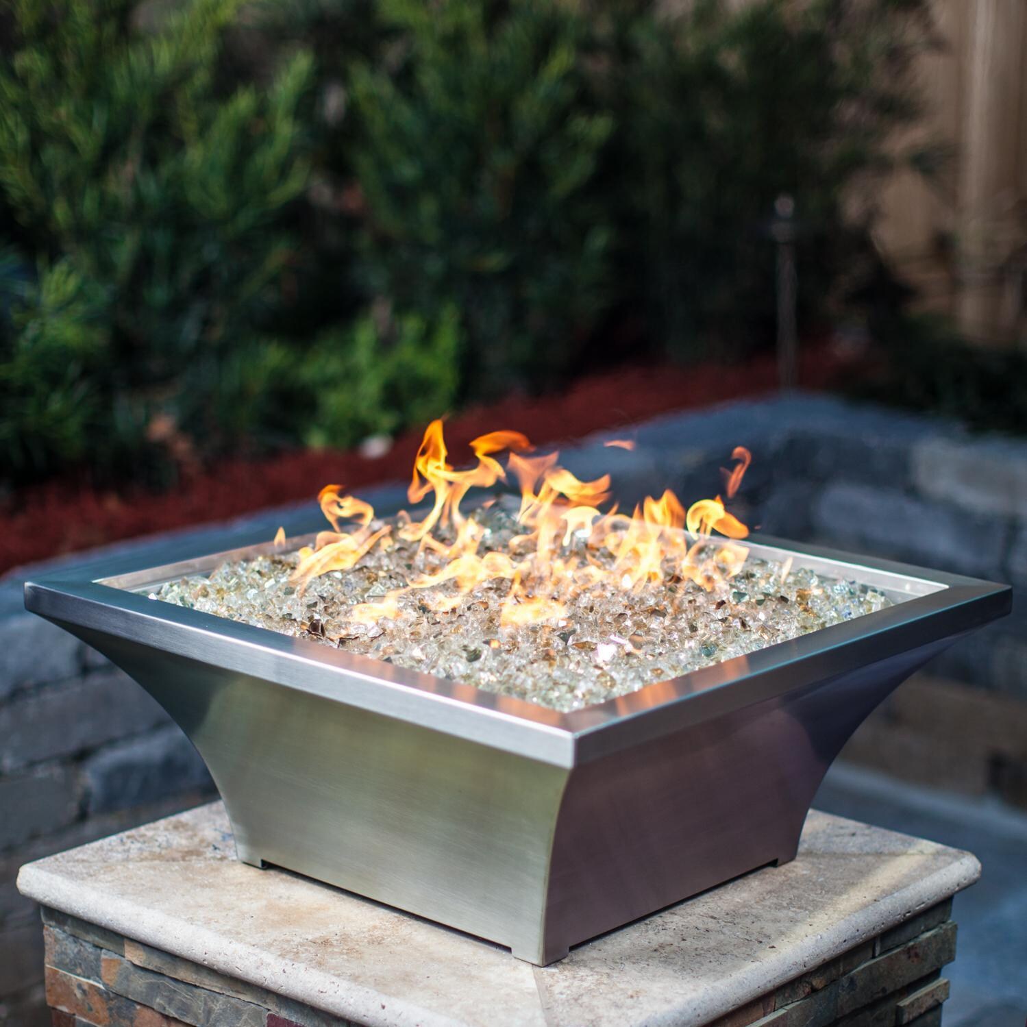 BBQGuys Signature Series Lavelle 24-Inch Square High-Rise Natural Gas Fire Bowl - Stainless Steel - Angled - Shown with 1/2 inch White Gold Reflective Fire Glass thumbnail