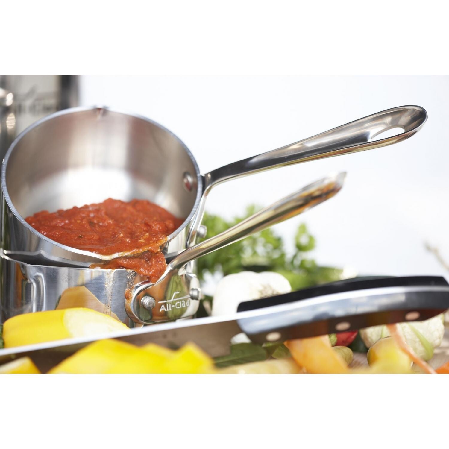 All-Clad Stainless Measuring Cup Set In Use thumbnail