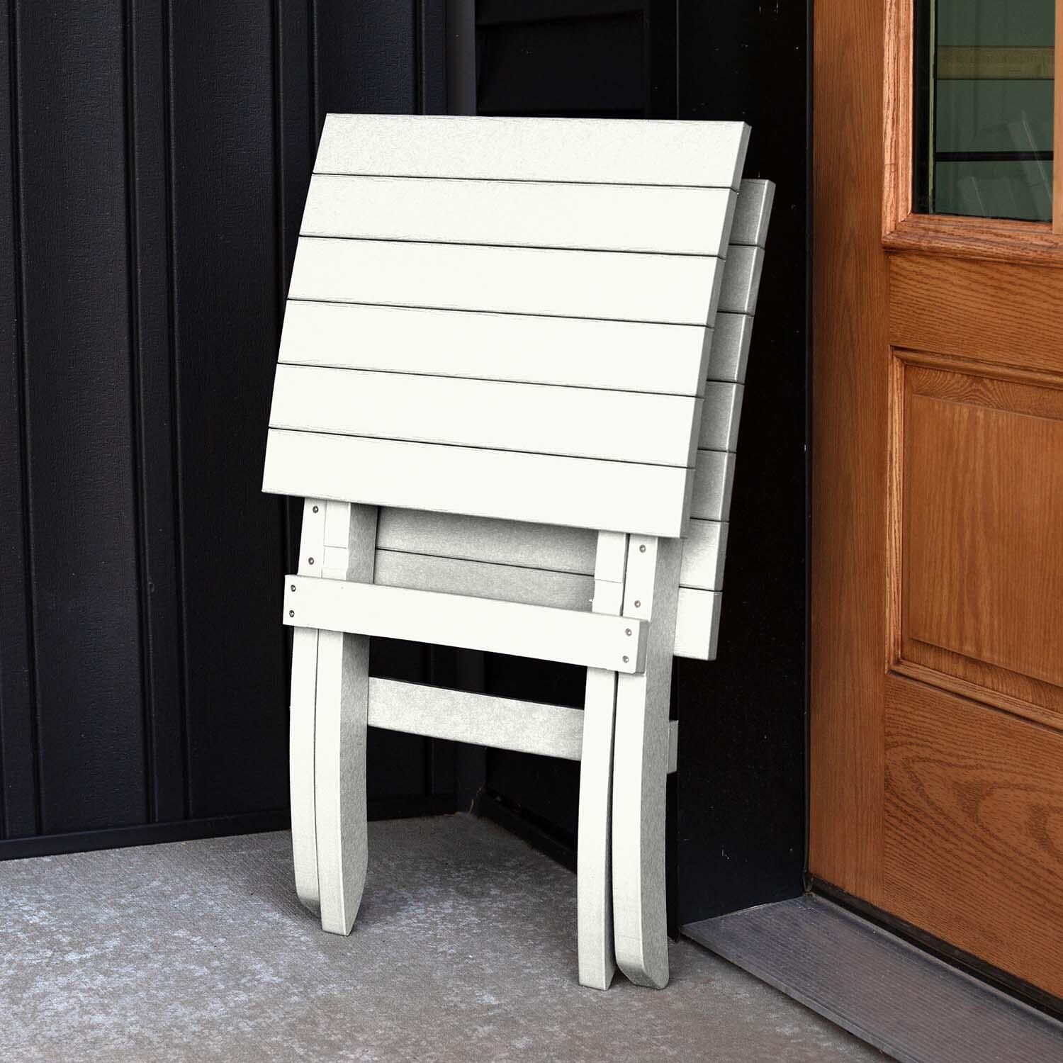 Hazel Cove Recycled Plastic Folding & Stacking Dining Side Chair in Coconut White by Lakeview Outdoor Designs - Folded - Lifestyle thumbnail