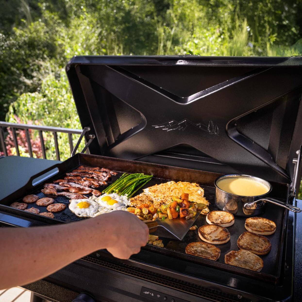 Traeger Flatrock 3 Zone Propane Griddle 4 Pc Bundle - Cooking on Griddle - Lifestyle thumbnail