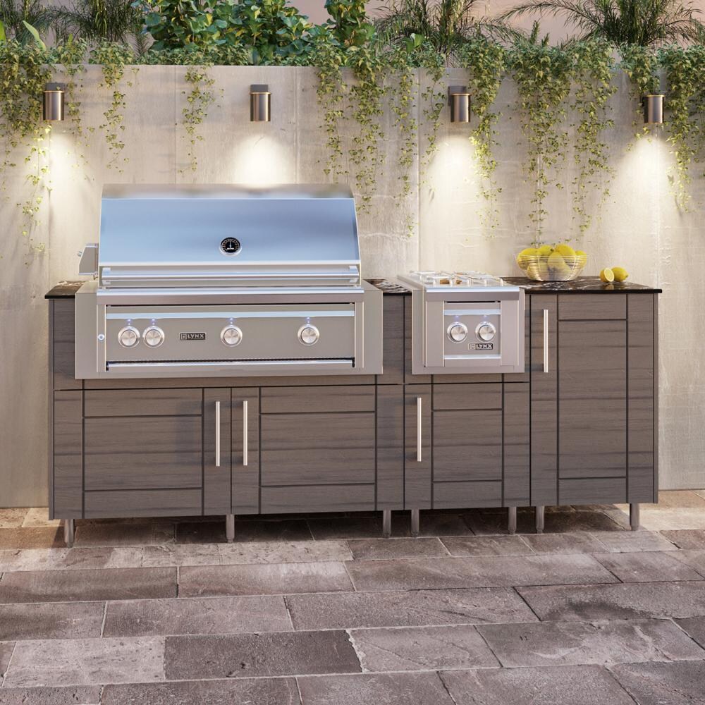 WeatherStrong Abaco 7 Ft Outdoor Kitchen Island w/ Blaze Propane Grill & Side Burner in Dark Ash/Midnight Ice - On Patio - Lifestyle thumbnail