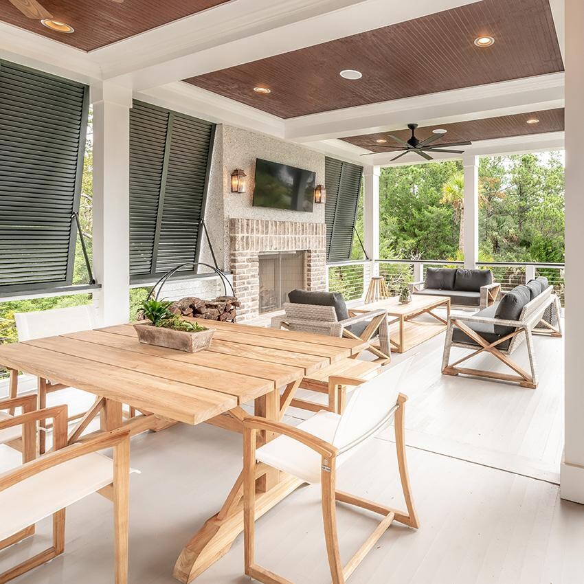 Teak + Table Capri Sling Dining Chair in Black - Chairs on Patio - Lifestyle thumbnail