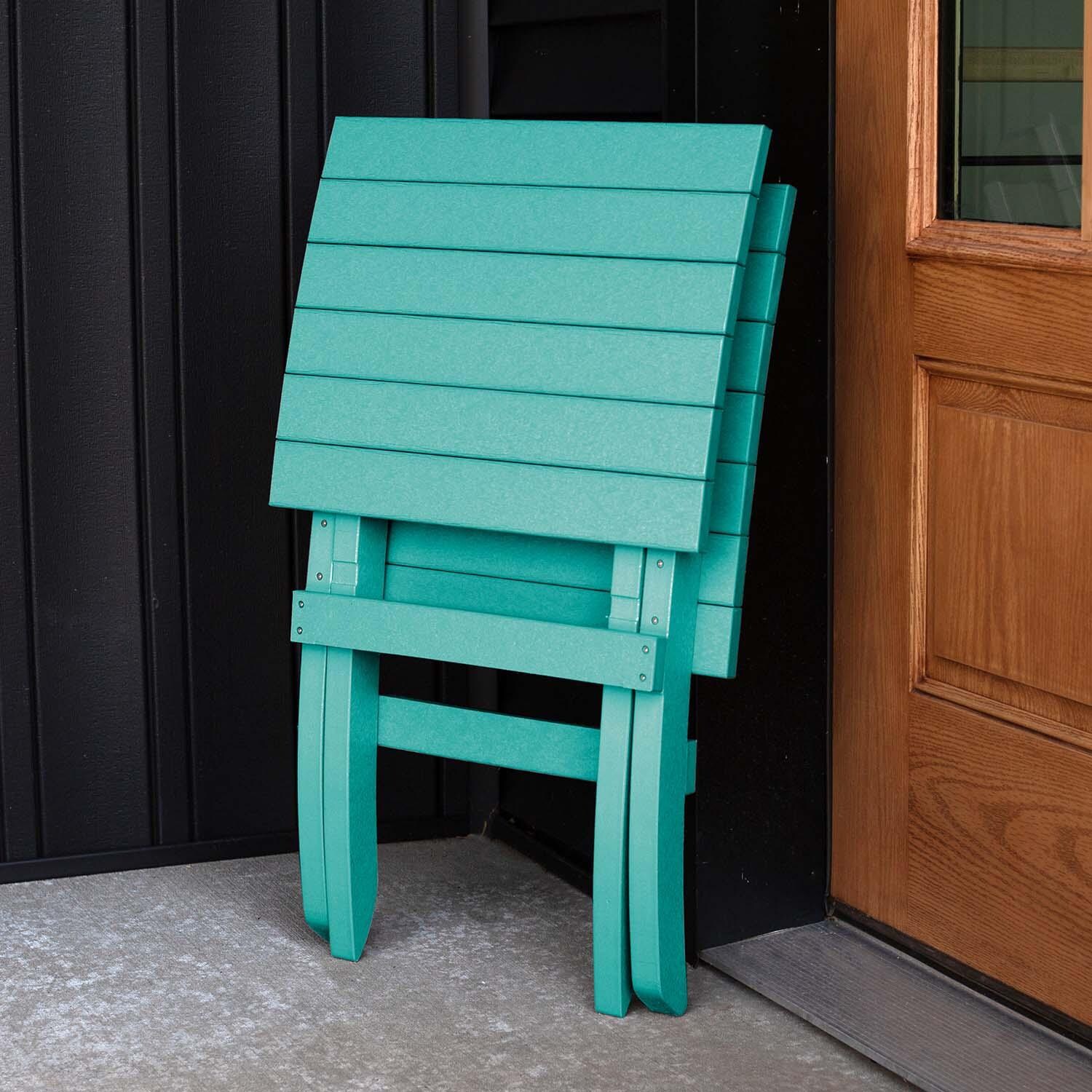 Hazel Cove Recycled Plastic Folding & Stacking Dining Side Chair in Seaglass Blue by Lakeview Outdoor Designs - Folded - Lifestyle thumbnail