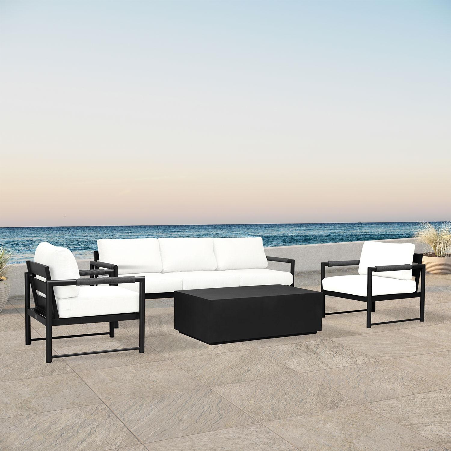 Lakeview AVEBAY-BK-CO-SET135-CN Avenue Bay Black/Carbon 4 Pc Sofa Set - Canvas Natural - Angled On Patio - Lifestyle thumbnail