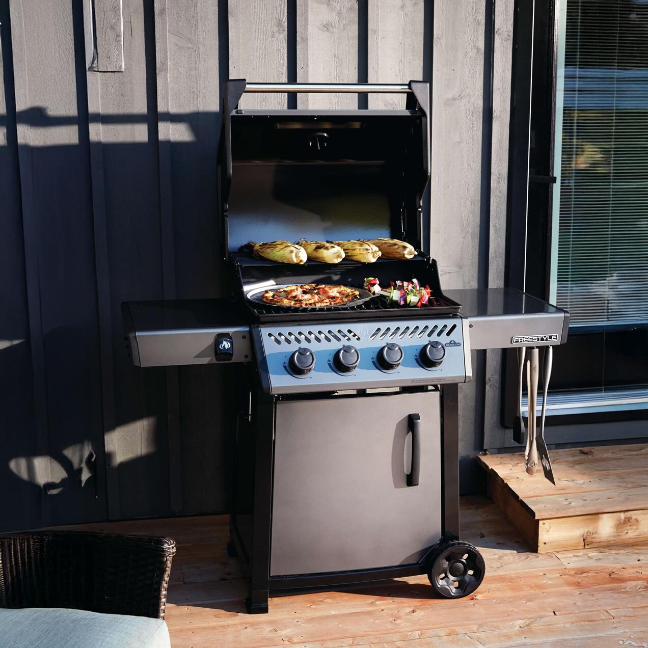 Napoleon F425DPGT Freestyle 425 4 Burner Propane Gas Grill - Graphite Grey - Open on Patio - Lifestyle thumbnail