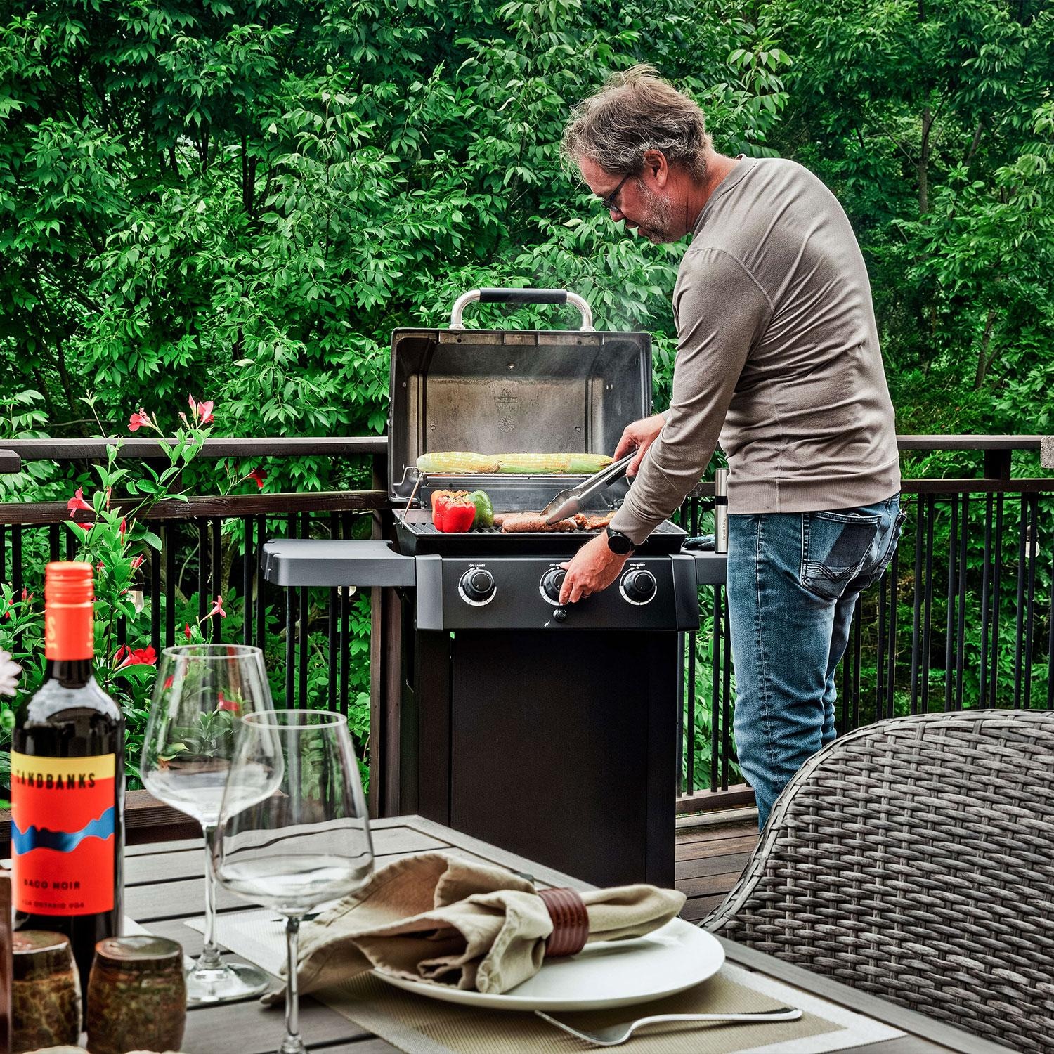 Broil King 814954 Gem 310 Shadow 3 Burner Propane Grill - Adjusting Burner Knobs - Lifestyle thumbnail