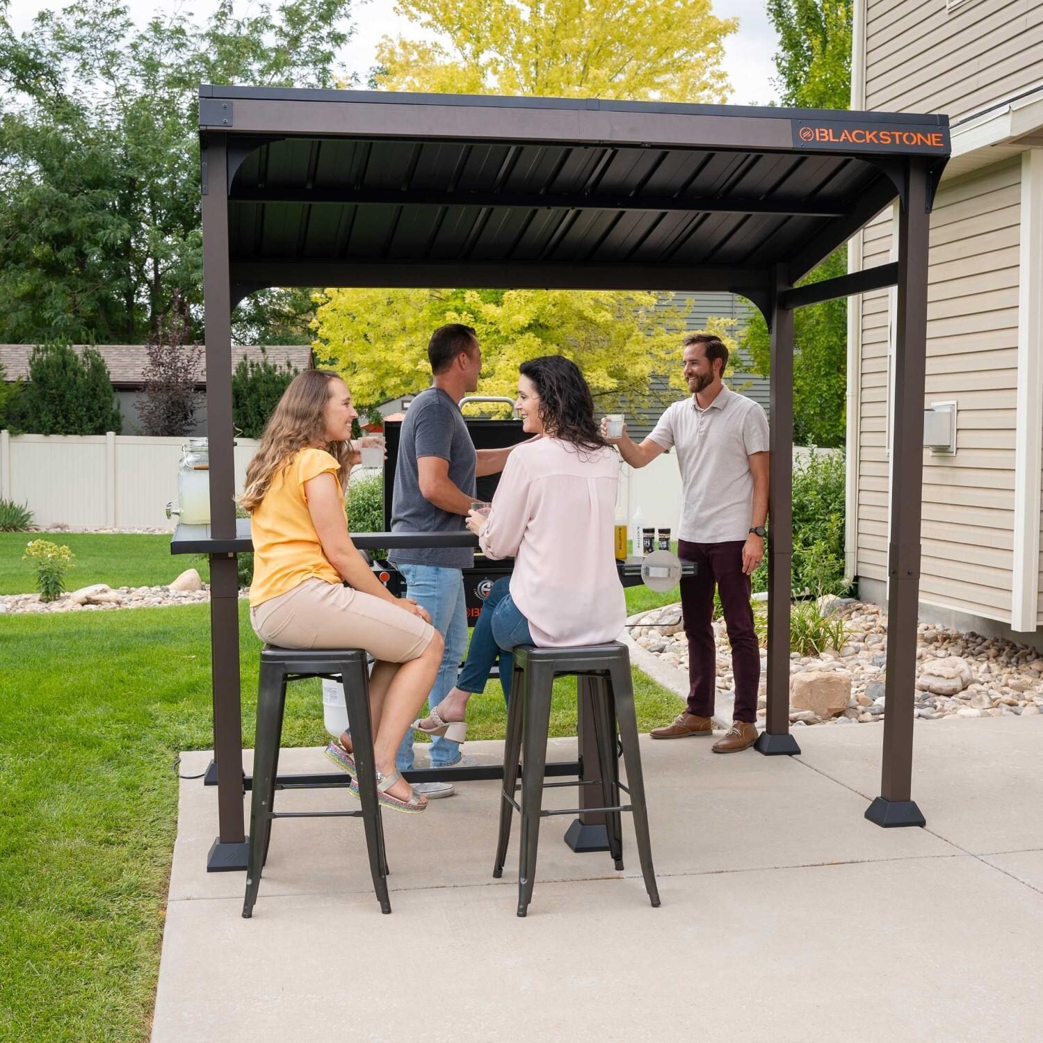 Blackstone 5 x 8-Foot Outdoor Pavilion - Friends Gathered Under Pavilion - Angled View - Lifestyle thumbnail