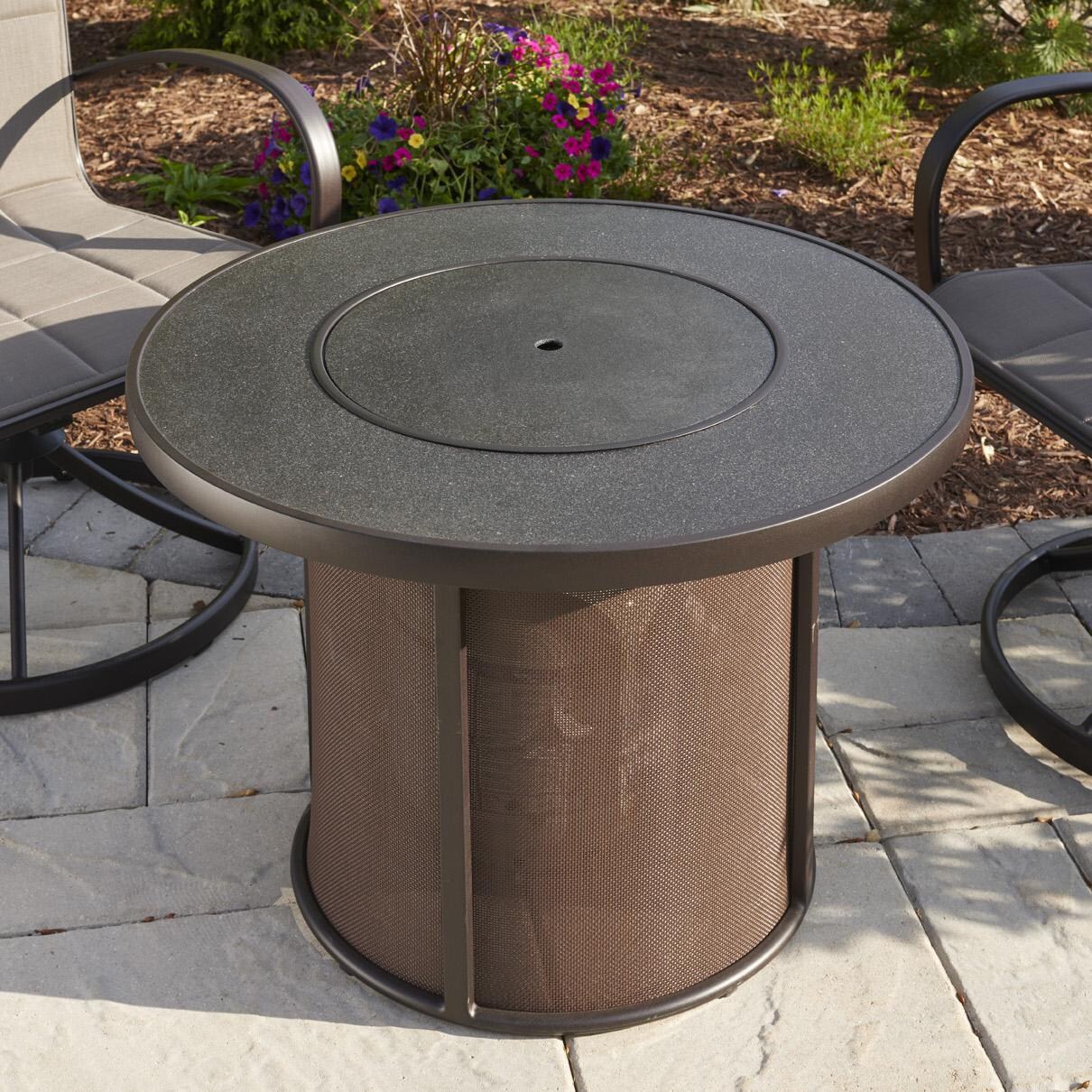 The Outdoor GreatRoom Company Stonefire Round Gas Fire Pit Table - Lifestyle - Includes matching burner cover thumbnail
