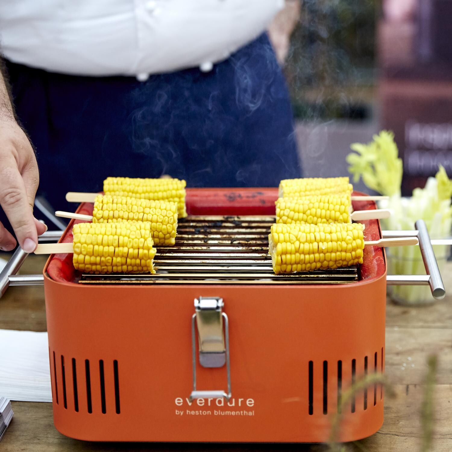 Everdure HBCUBEOUS CUBE 17-Inch Portable Charcoal Grill - Orange - Grilling Corn - Lifestyle thumbnail