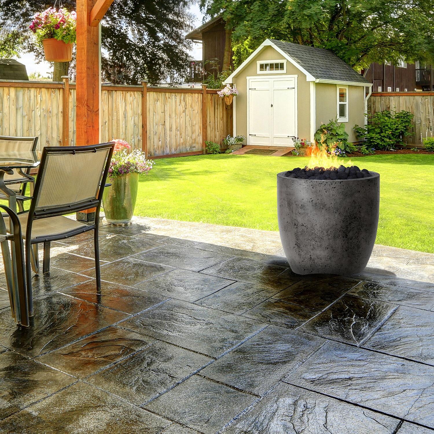 24-in Round Concrete Natural Gas Fire Urn in Gray by XO Appliance - Backyard Setting - Lifestyle thumbnail
