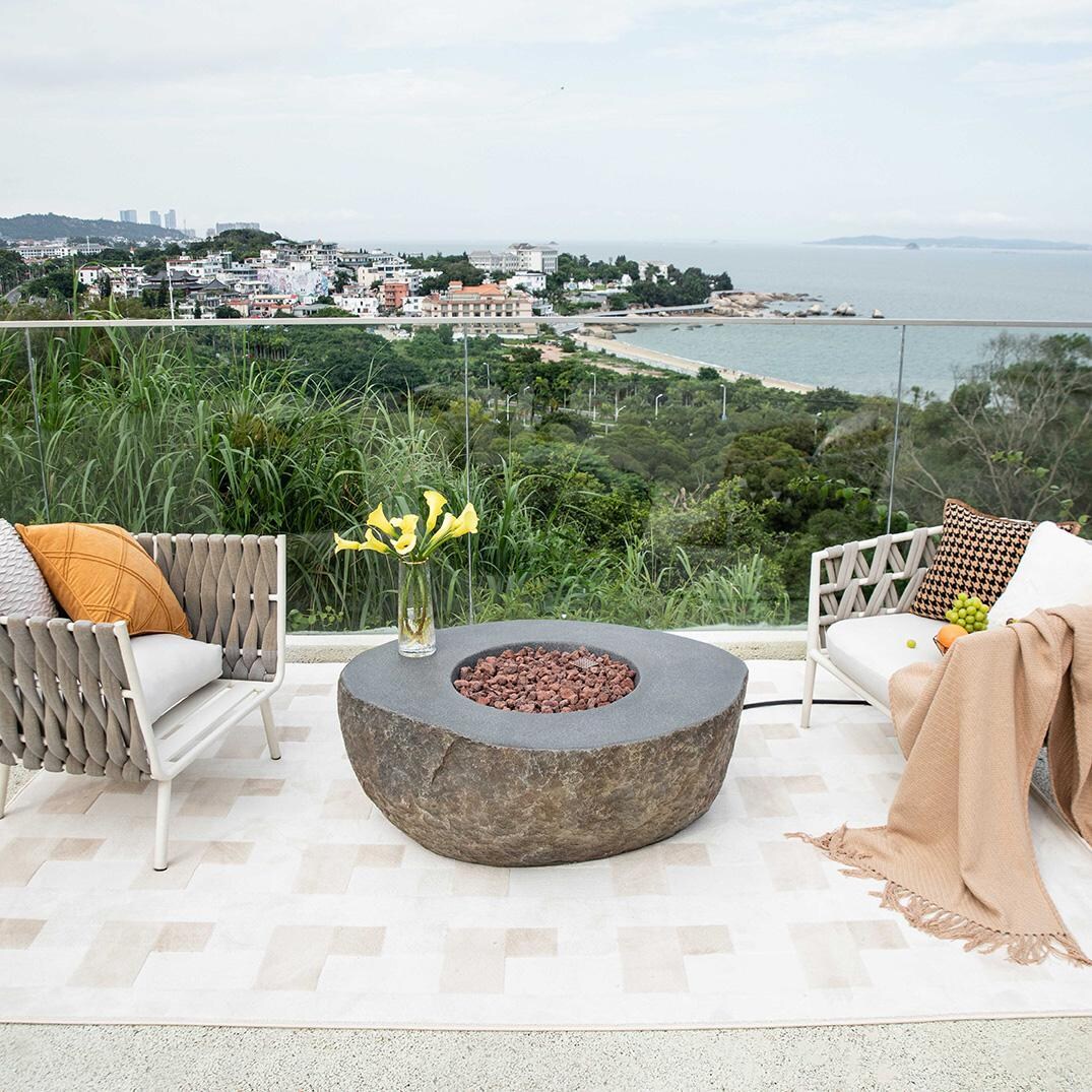 Elementi OFG110-LP Boulder 43-Inch Round Propane Fire Pit Table - On Balcony - Lifestyle thumbnail