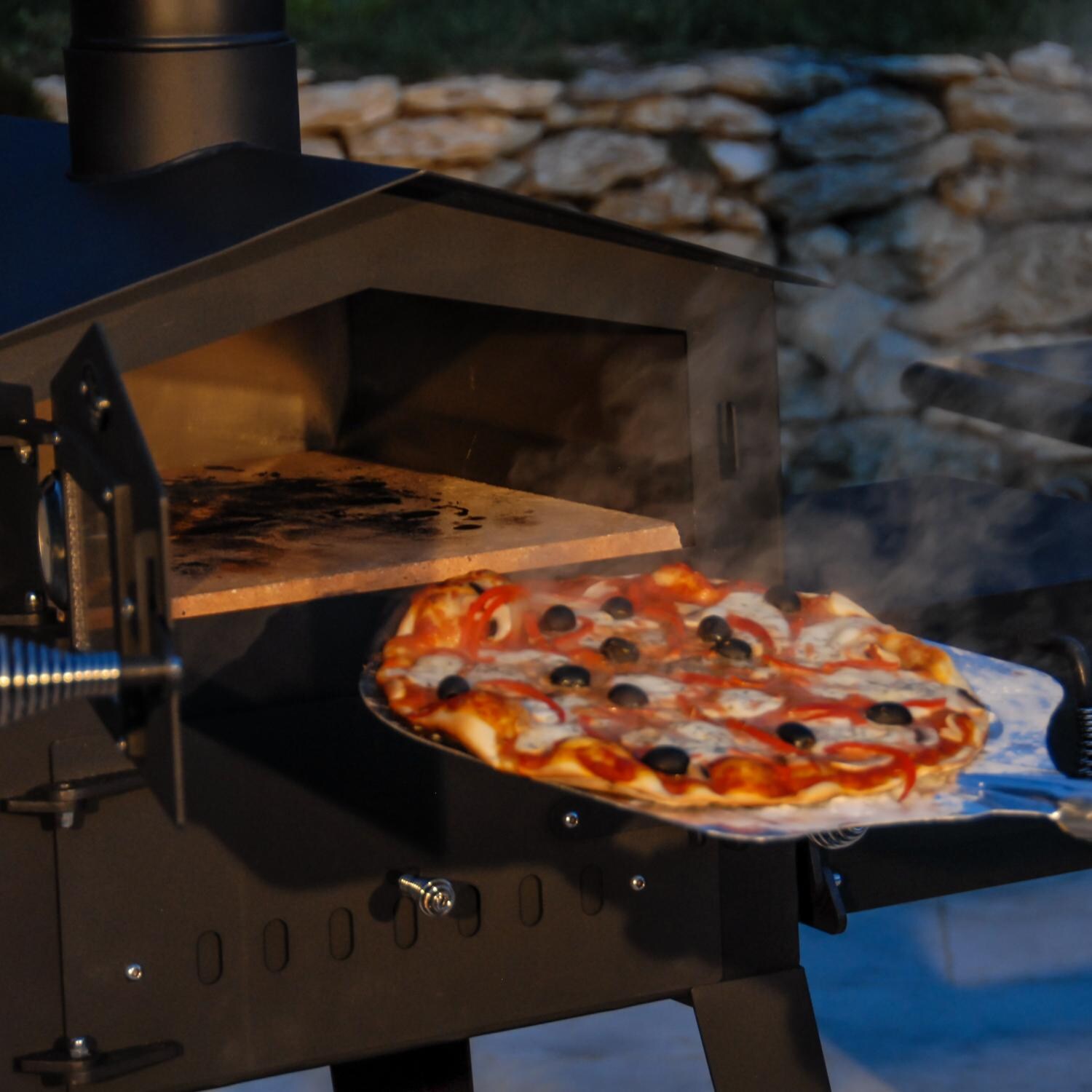 L'Art Du Jardin Le Boulanger Wood Burning Outdoor Pizza Oven - Shown Baking Pizza thumbnail
