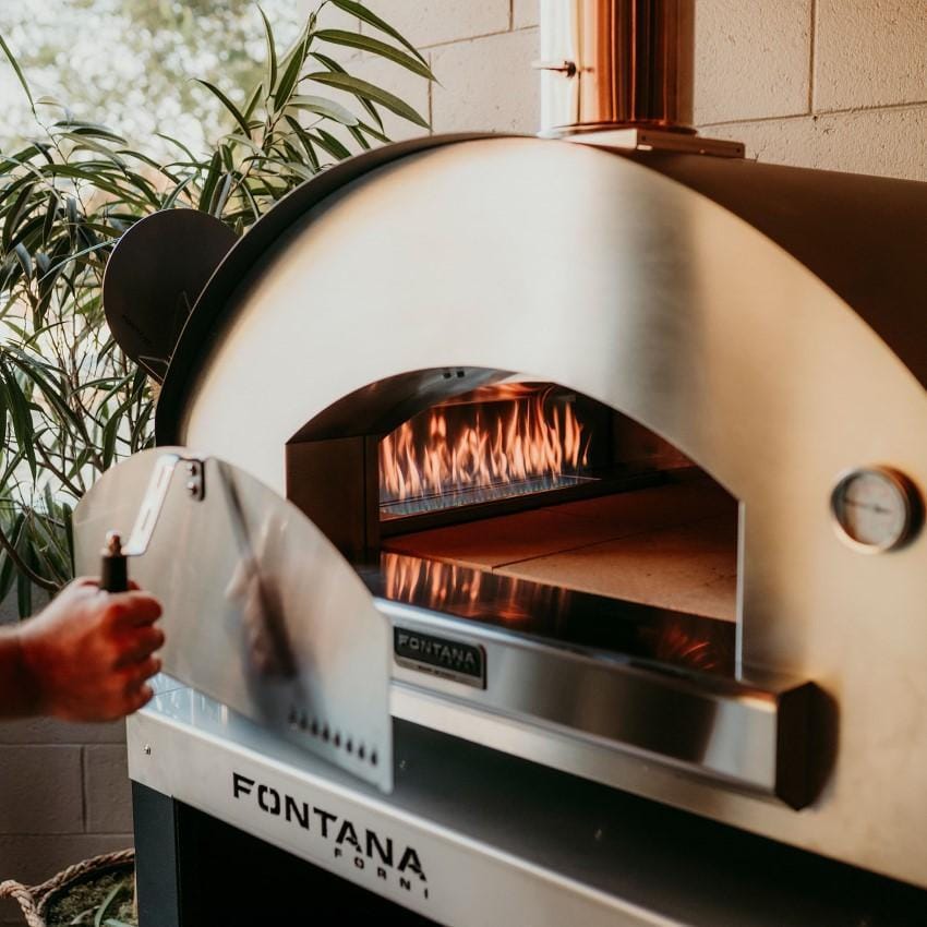 Fontana Forni FTFIR-H-R + FTCART-L Firenze Hybrid Pizza Oven on Cart - Red - Closing The Oven - Lifestyle thumbnail