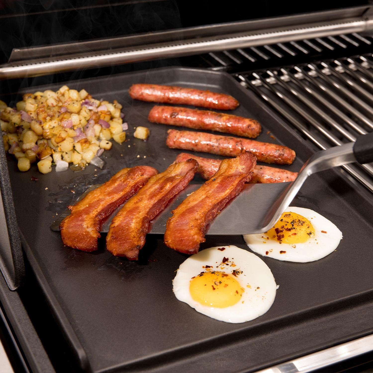 Broil King 11342 Cast Iron Plancha - Flipping Bacon - Lifestyle thumbnail