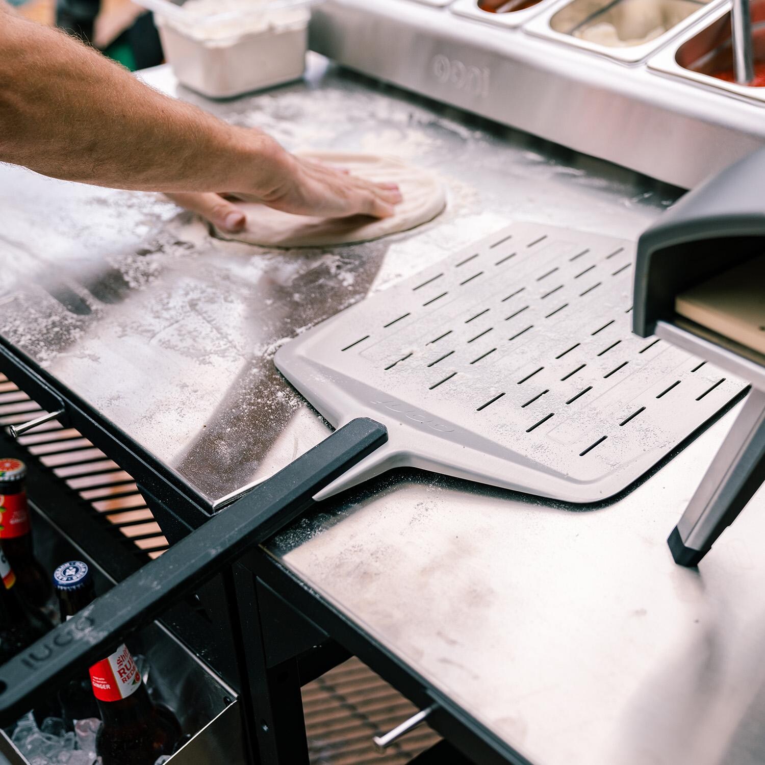 Ooni UU-P06500 14-Inch Perforated Pizza Peel - Making Pizza thumbnail