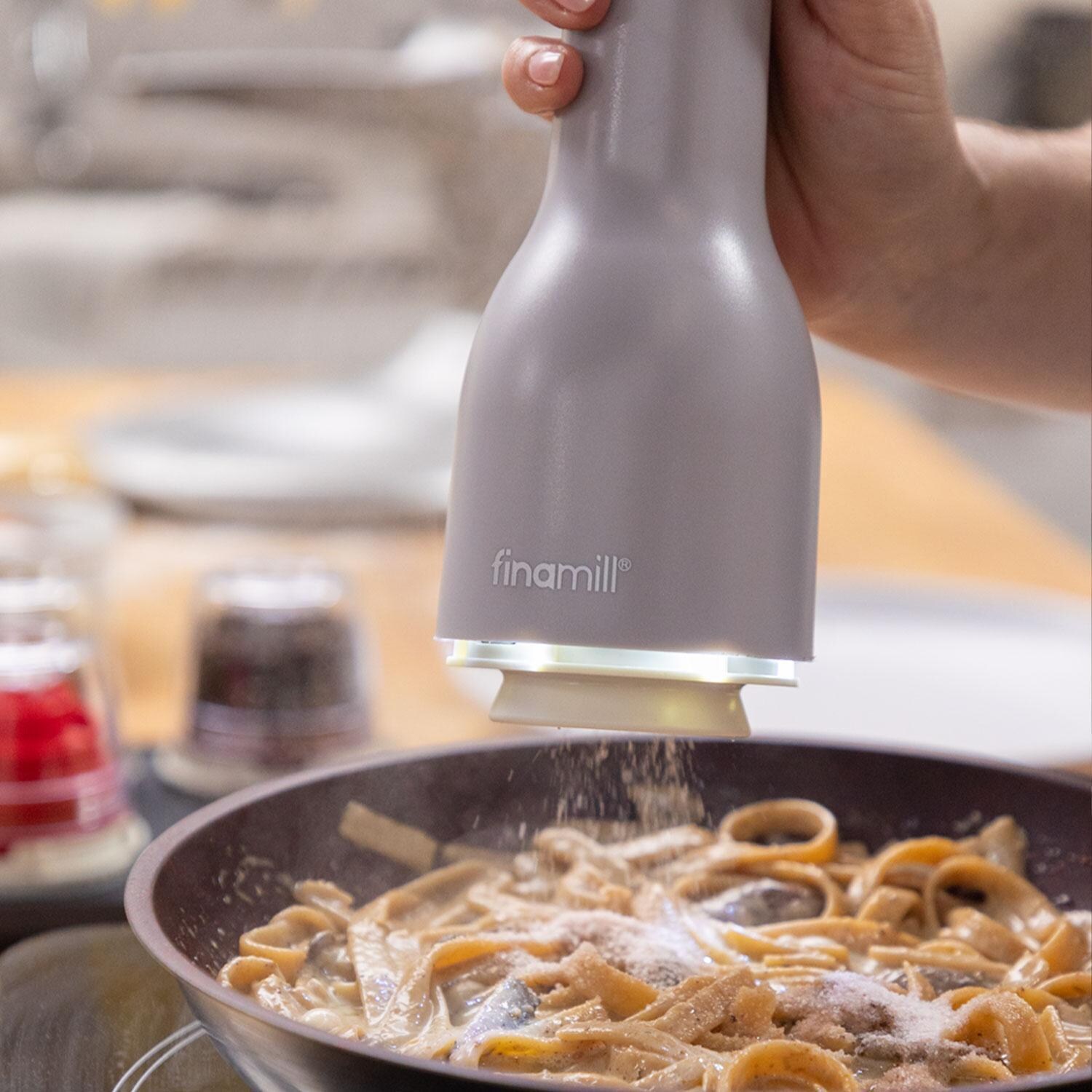 FinaMill GP813437-111STO Classic Rechargeable Spice Grinder in Stone w/ 1 Everyday Pod & 1 Peppercorn Pod - In Use - Lifestyle thumbnail