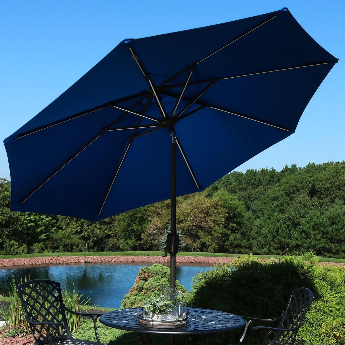 Ultimate Patio 9 Ft. Solar Lighted Octagonal Aluminum Patio Market Umbrella W/ Crank & Tilt - Black Frame & Pacific Blue Sunbrella Canopy Ultimate Patio 9 Ft. Solar Lighted Octagonal Aluminum Patio Market Umbrella W/ Crank & Tilt - Black Frame & Pacific Blue Sunbrella Canopy