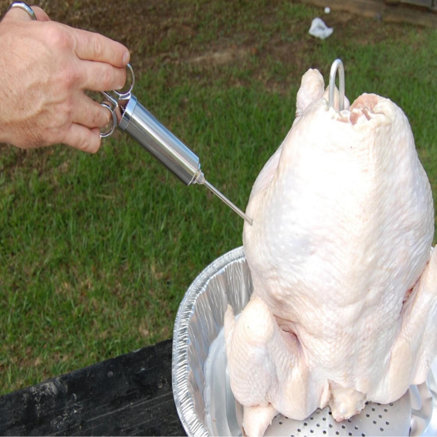 Bayou Classic 2 Ounce Stainless Steel Seasoning Injector - 5011 - Using Injector thumbnail