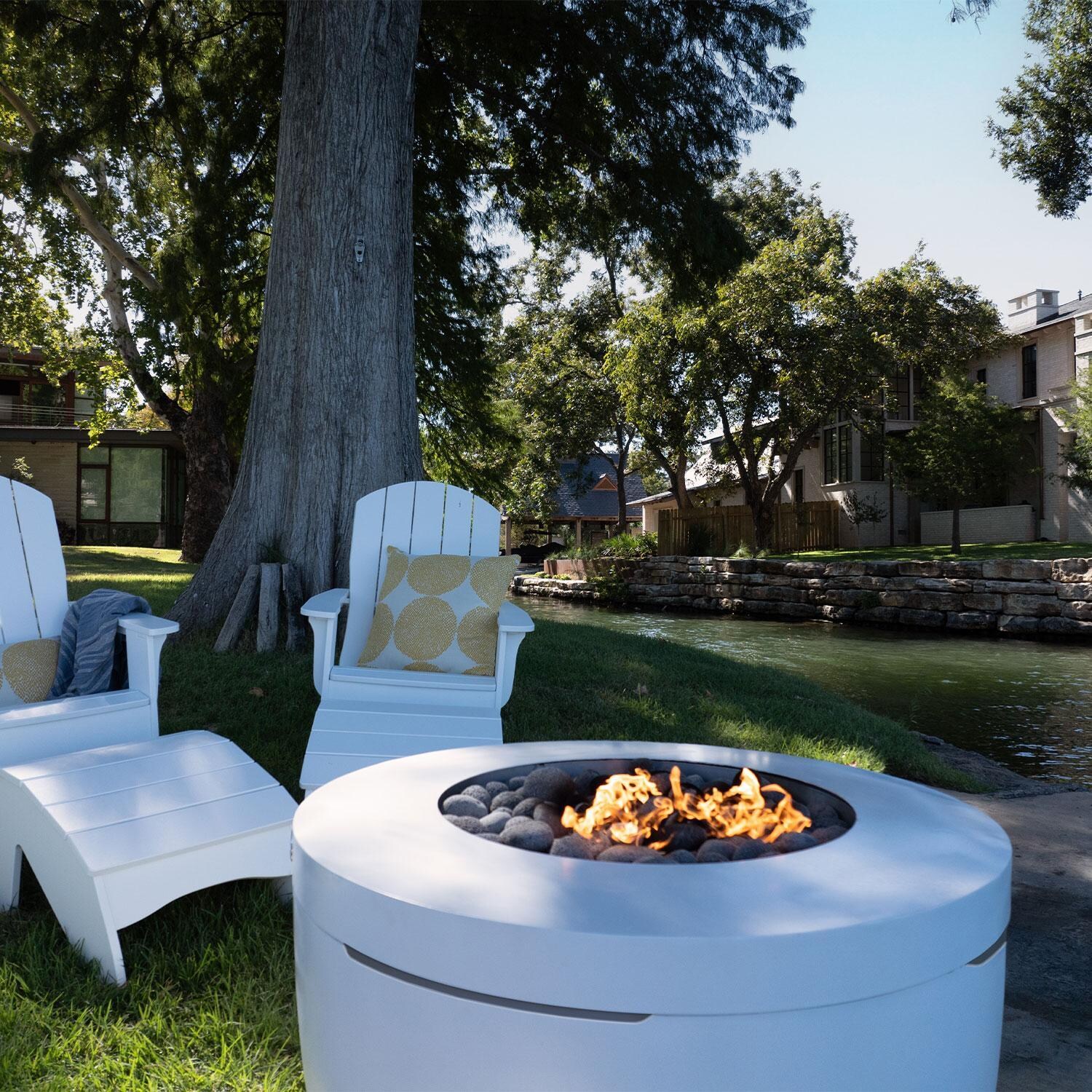 Halo LL-FL-FP-PR-RD40-SNS 40-in Round Powder Coated Steel Propane Fire Pit in Sunset by Ledge Lounger - Backyard - Shown in Moonrise finish - Lifestyle thumbnail