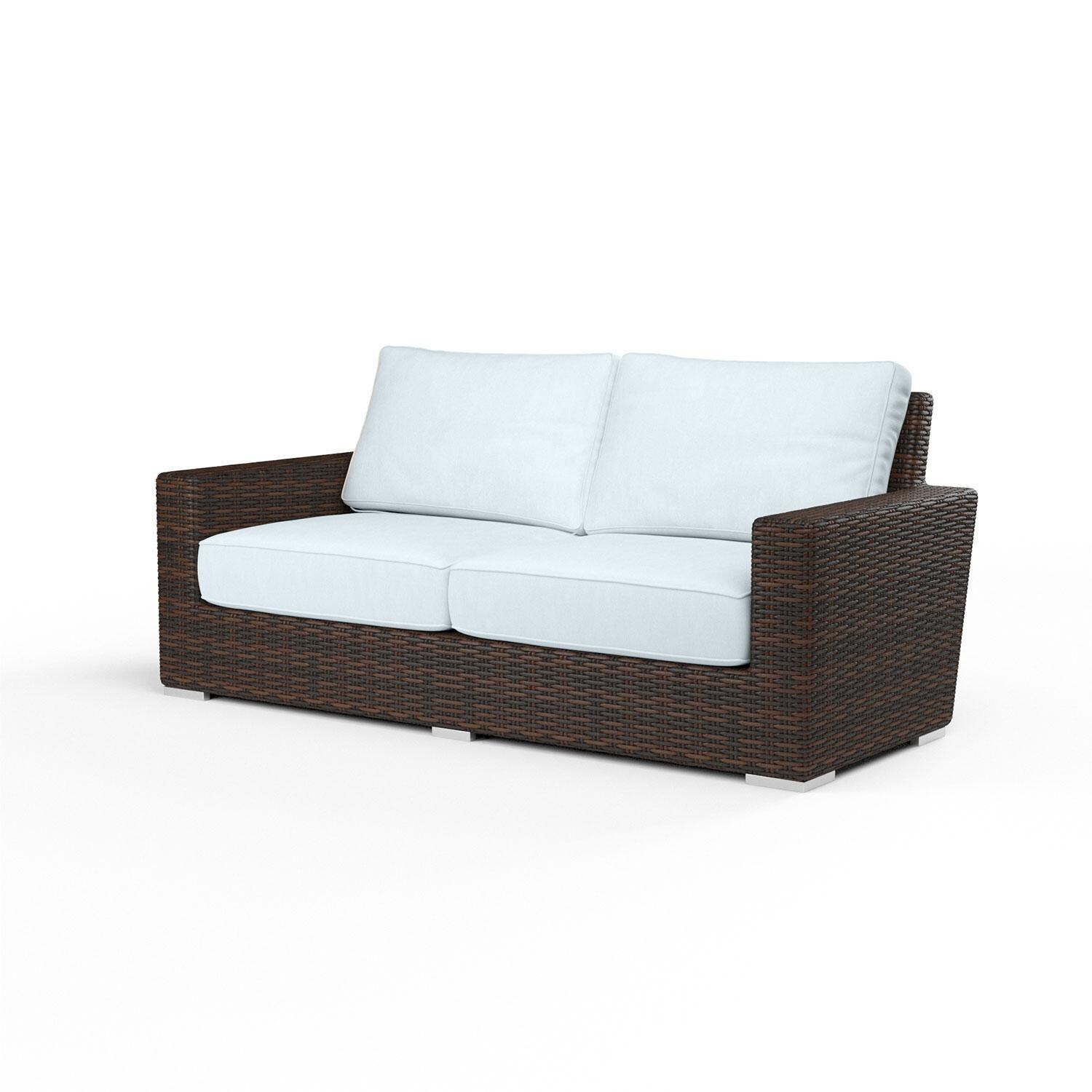 Montecito Wicker Patio Loveseat in Canvas Skyline w/ Self Welt By Sunset West - Display - White Background thumbnail