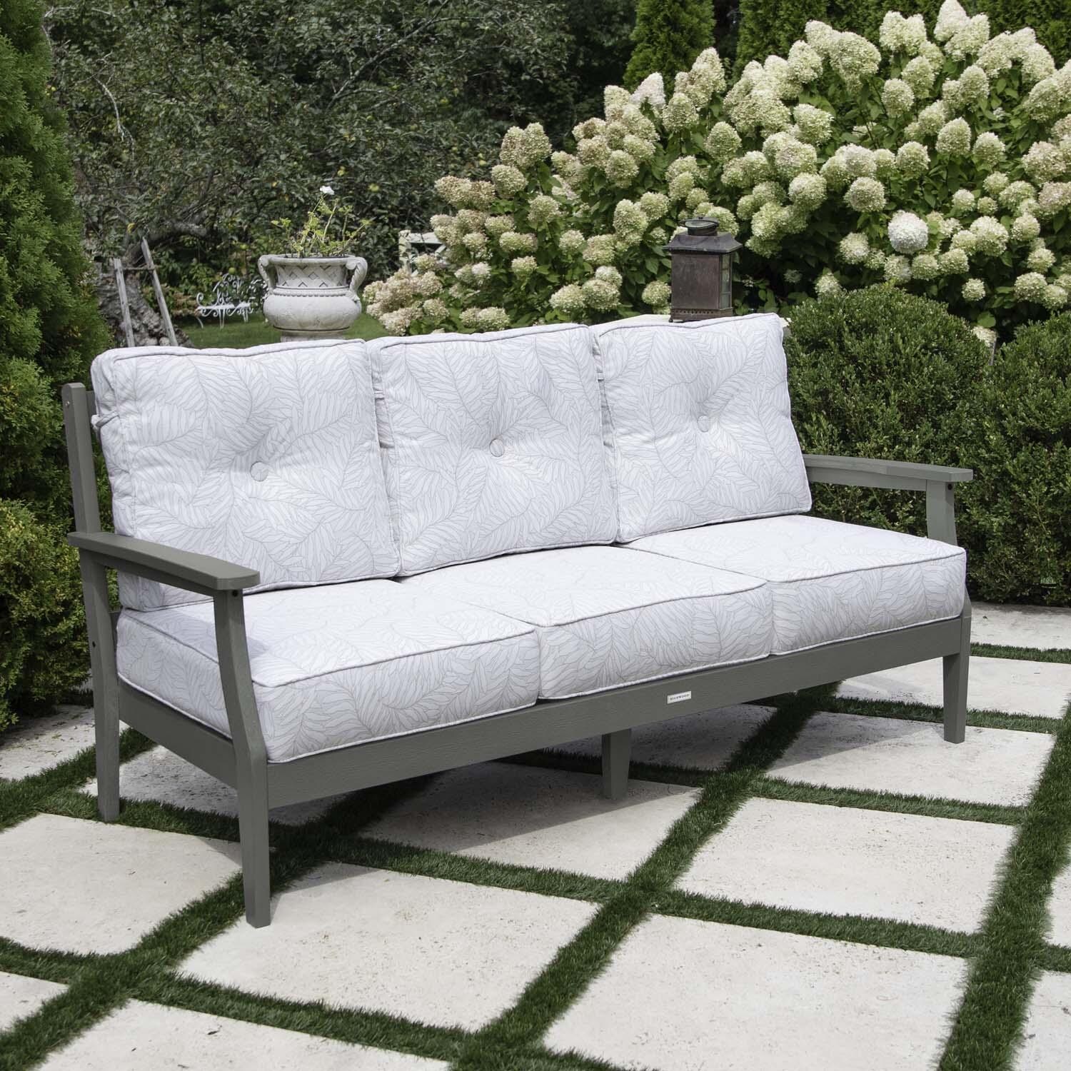 Blushing Bay 3 Person Recycled Plastic Sofa in Lively Parchment/Coastal Teak by Lakeview Outdoor Designs - Left Angled - Lifestyle thumbnail