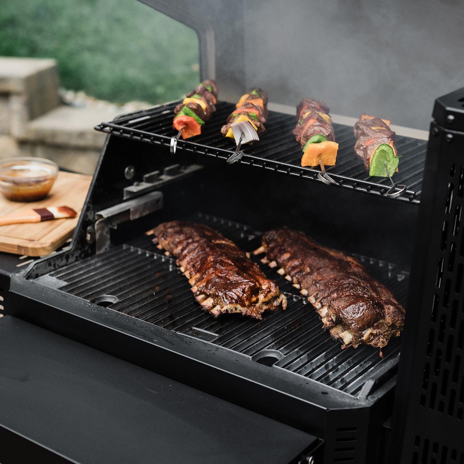 Masterbuilt MB20041023 Gravity Series 600 Digital Charcoal Grill + Smoker - Cooking Angle - Lifestyle