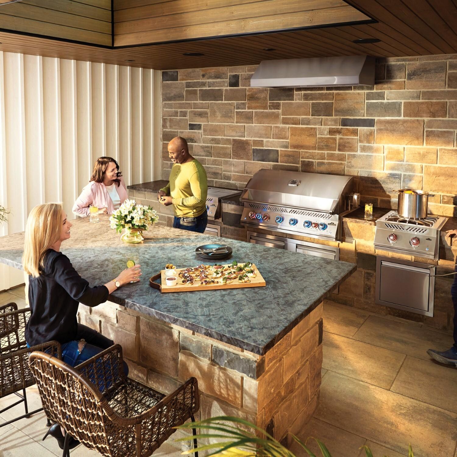 Napoleon BIG44RBNSS-1 Natural Gas Grill - Friends Standing By Grill - Lifestyle thumbnail