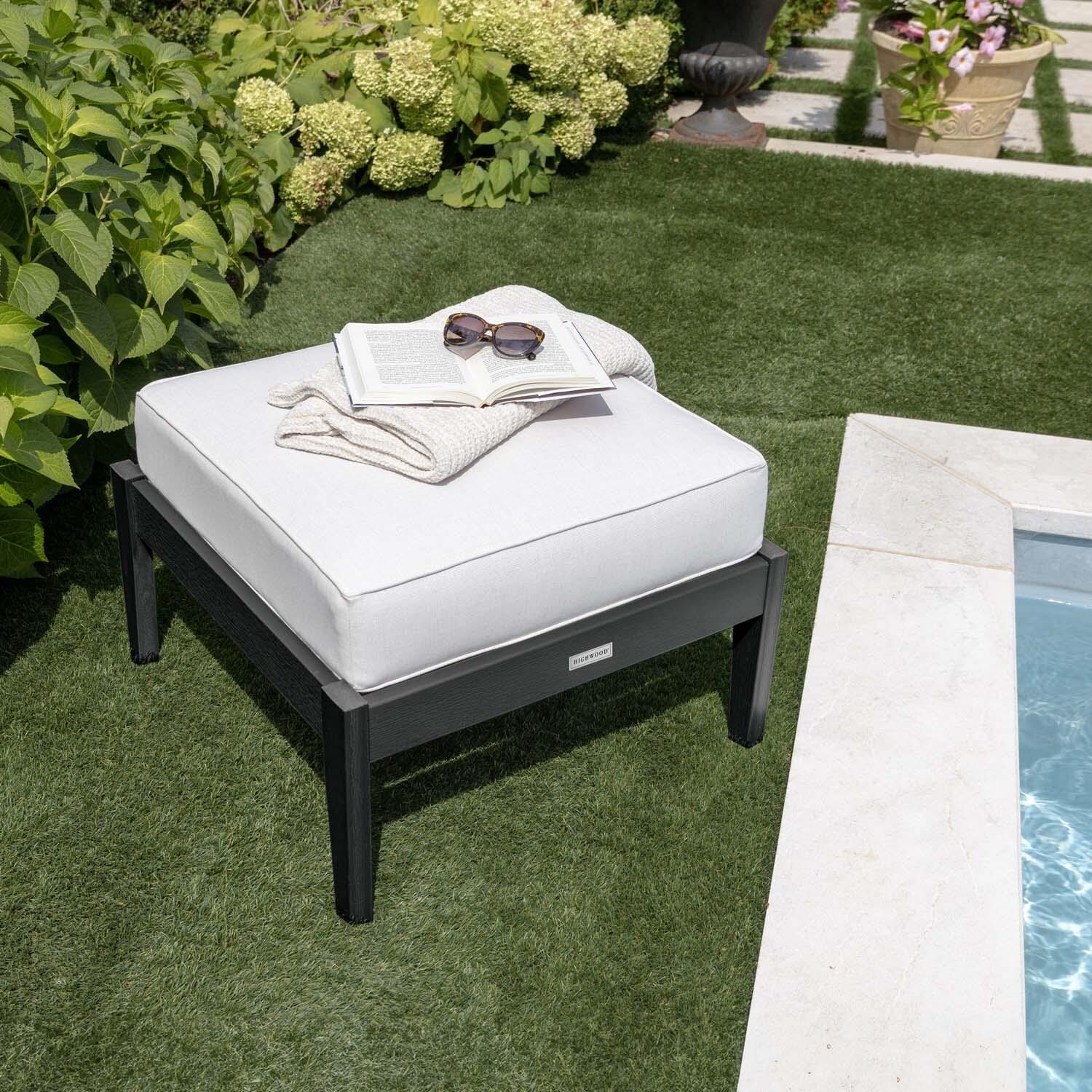 Blushing Bay Recycled Plastic Ottoman in Bliss Linen/Black by Lakeview Outdoor Designs - By Pool Close Up - Lifestyle thumbnail