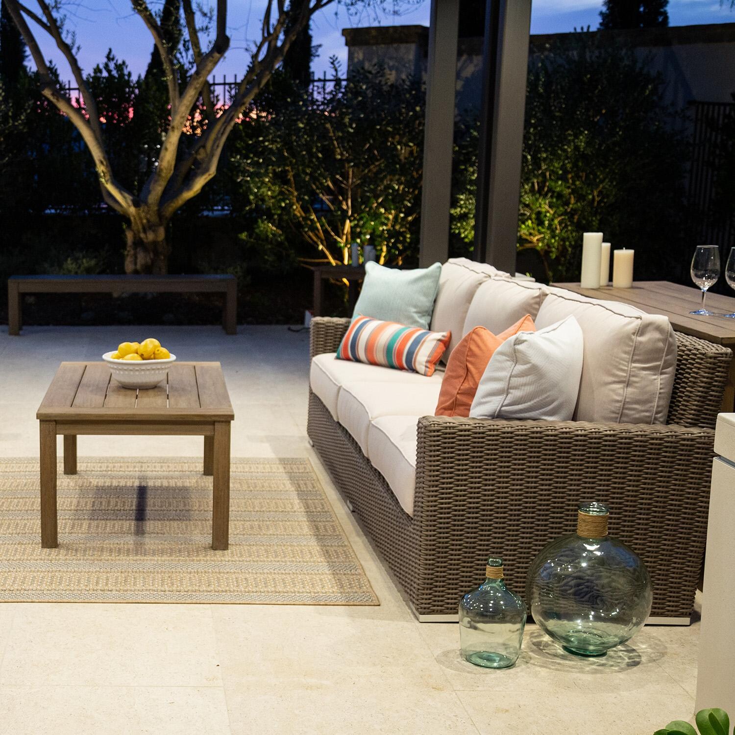 Coronado 3 Person Wicker Sofa in Driftwood/Canvas Henna by Sunset West - Shown in Different Fabric Side View - Lifestyle thumbnail