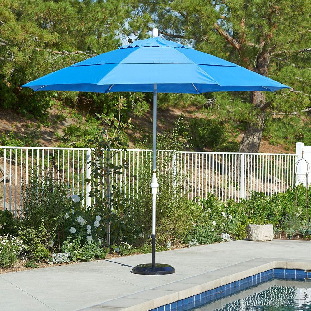 California Umbrella 11 Ft Octagonal Aluminum Collar Tilt Patio Umbrella W/ Crank Lift & Fiberglass Ribs - Lifestyle (Shown in Sunbrella Cavnas Pacific Blue W/ White Frame) thumbnail