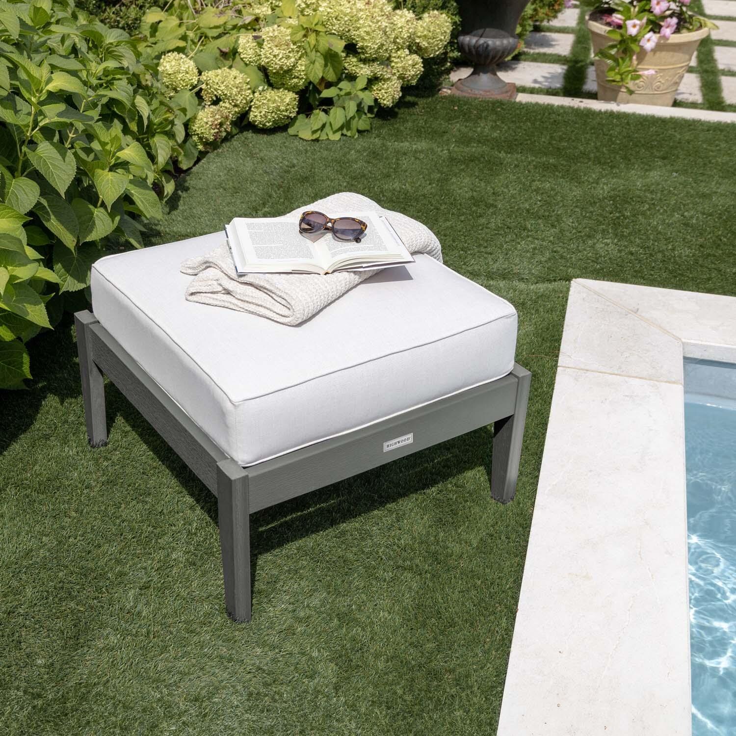 Blushing Bay Recycled Plastic Ottoman in Bliss Linen/Coastal Teak by Lakeview Outdoor Designs - By Pool Close Up - Lifestyle thumbnail