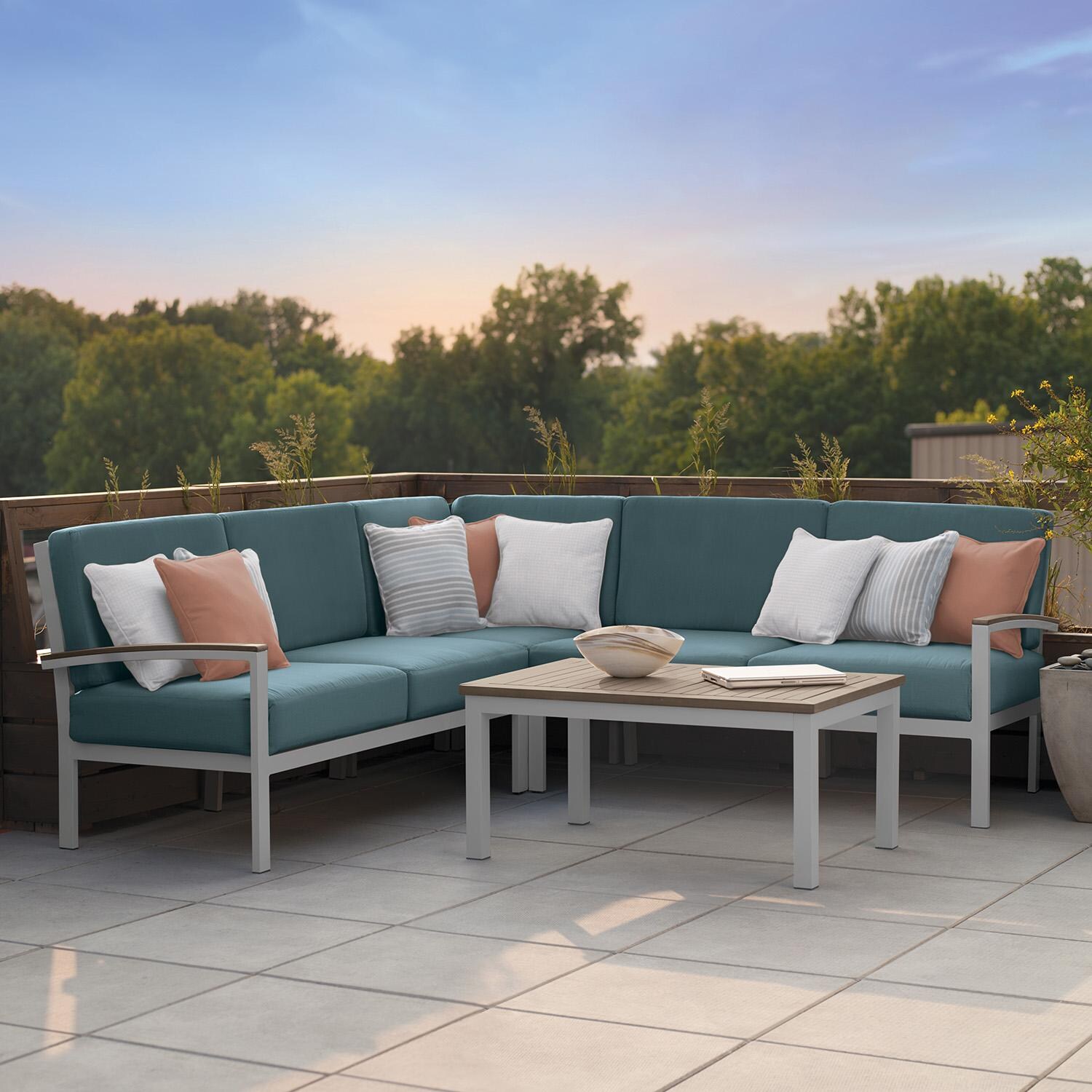 Oxford Garden 5276-PC.F Travira 4 Pc Aluminum Seating Set w/ Coffee Table in Vintage Tekwood/ Ice Blue by Oxford Garden - On Patio - Lifestyle thumbnail